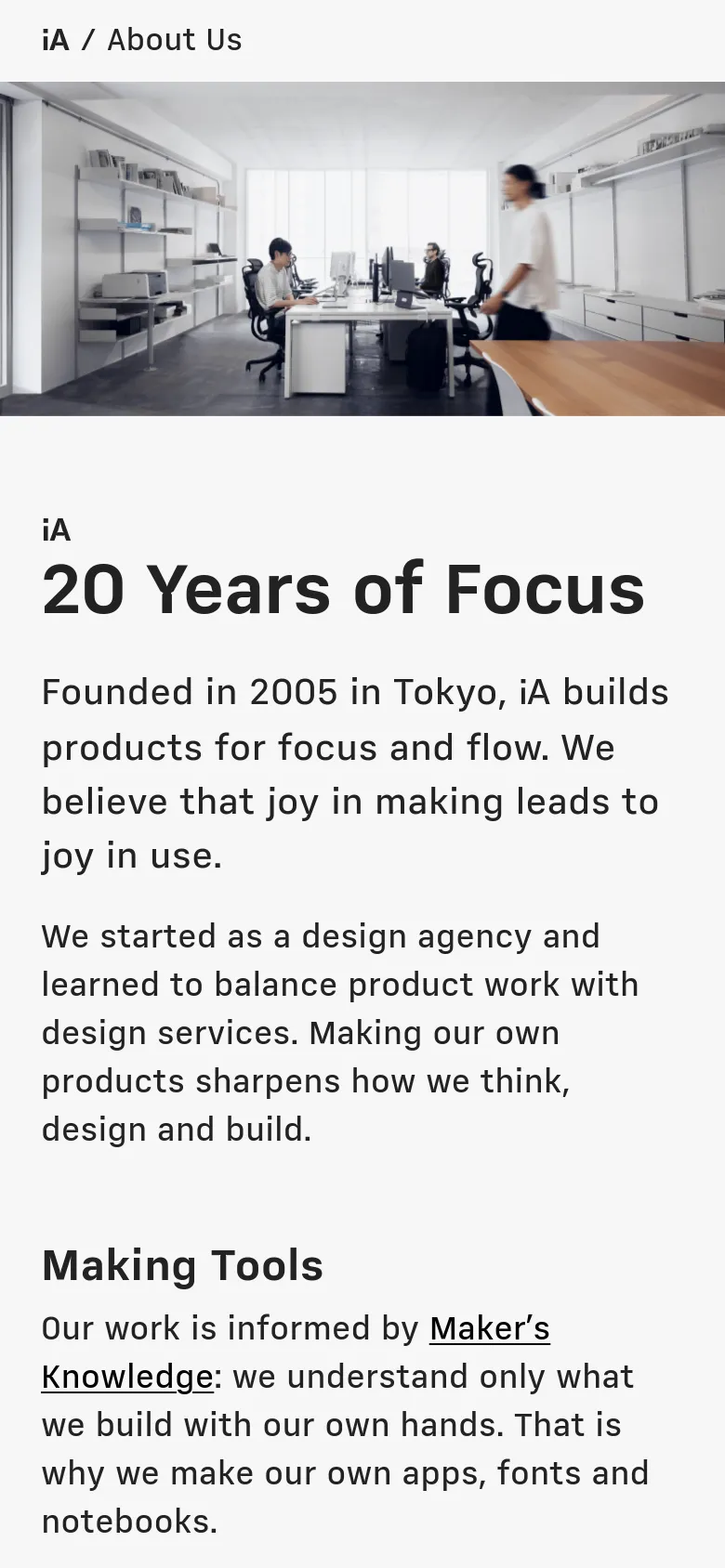 The mobile version maintains the same minimalist aesthetic but uses a single-column layout. The hero image of the Tokyo office is scaled to fit the width of the screen, and the text content, including the '20 Years of Focus' headline, is stacked vertically for easier scrolling on a narrow device.