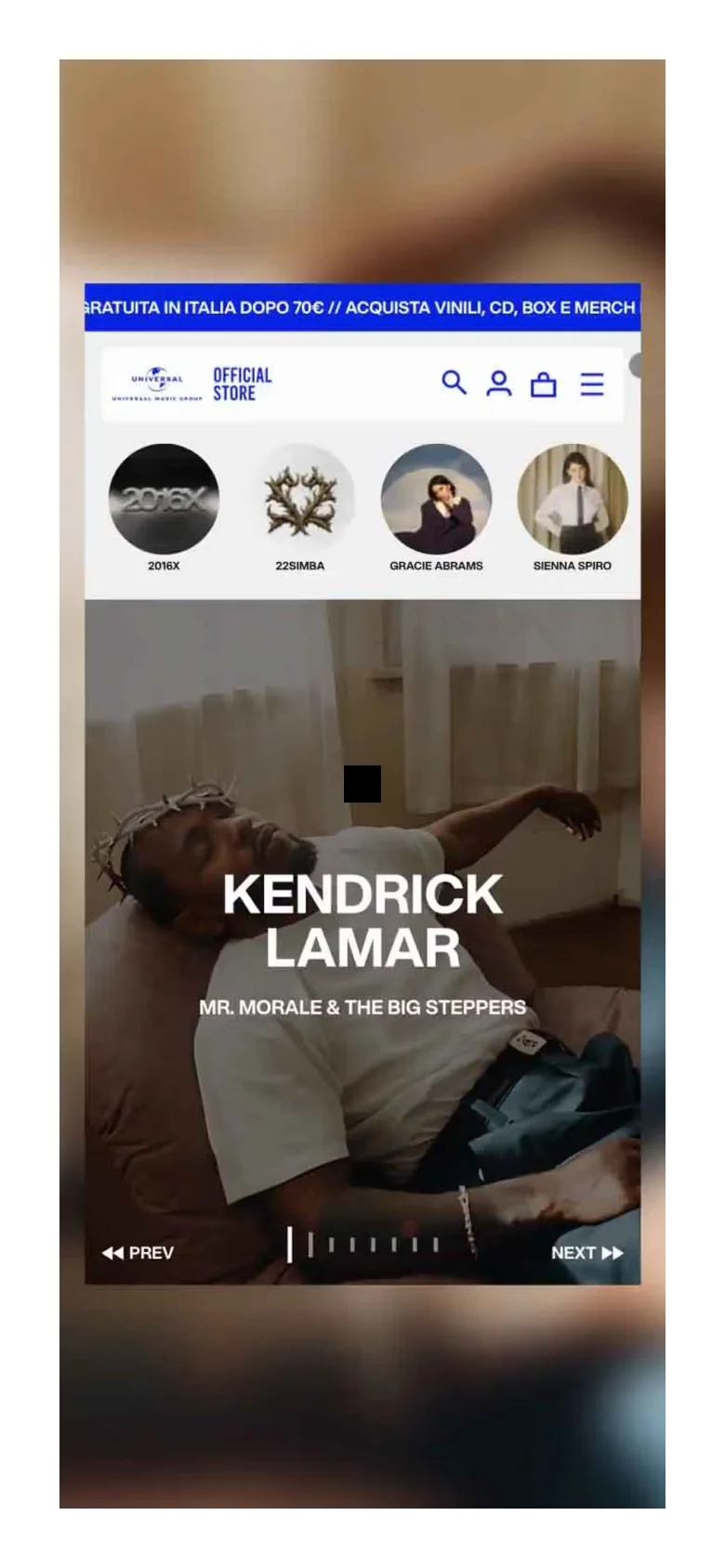 The mobile version simplifies the layout, replacing the horizontal navigation bar with a hamburger menu icon. The hero section remains prominent, featuring Kendrick Lamar with large, centered text, while the project grid scales to a single-column vertical scroll for easier mobile viewing.