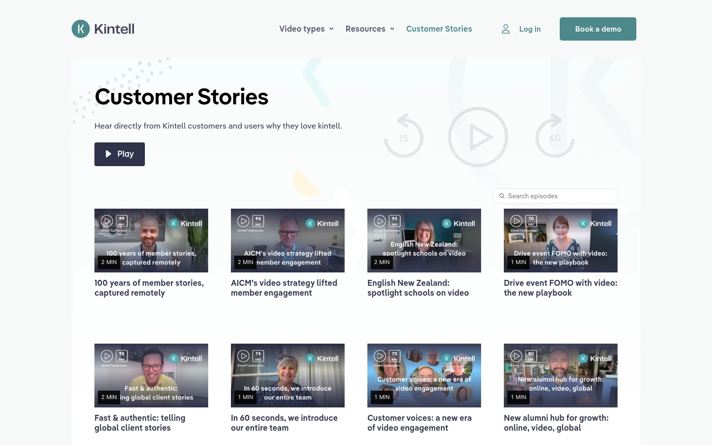 The desktop page features a light gray hero section with the headline 'Customer Stories' and a dark 'Play' button. Below, a grid of video testimonial cards displays thumbnails of people, video durations, and titles like '100 years of member stories, captured remotely.' The layout is spacious with a white background and a clean navigation bar at the top.