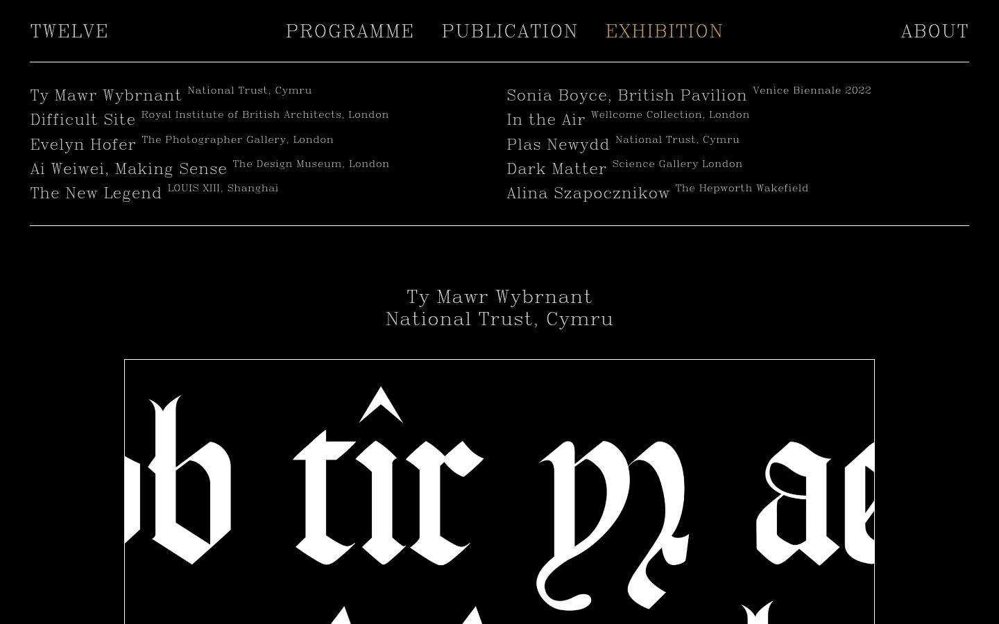The desktop version features a minimalist black background with white serif typography. A navigation menu sits at the top, followed by a list of exhibition projects, and a large hero section showcasing bespoke lettering for Ty Mawr Wybrnant with high-contrast imagery.