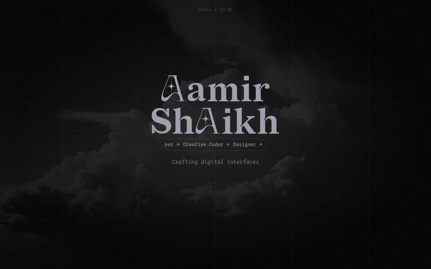 A dark, minimalist homepage featuring the name 'Aamir Shaikkh' in large, stylized white serif typography centered against a background of moody, dark clouds. The layout includes thin white grid lines and a circular graphic element, with the text 'Designer ✧ Developer ✧ Creative Coder' and 'Crafting digital interfaces' positioned below the name. A small time and location indicator, 'India ✧ 19:50', sits at the top center.