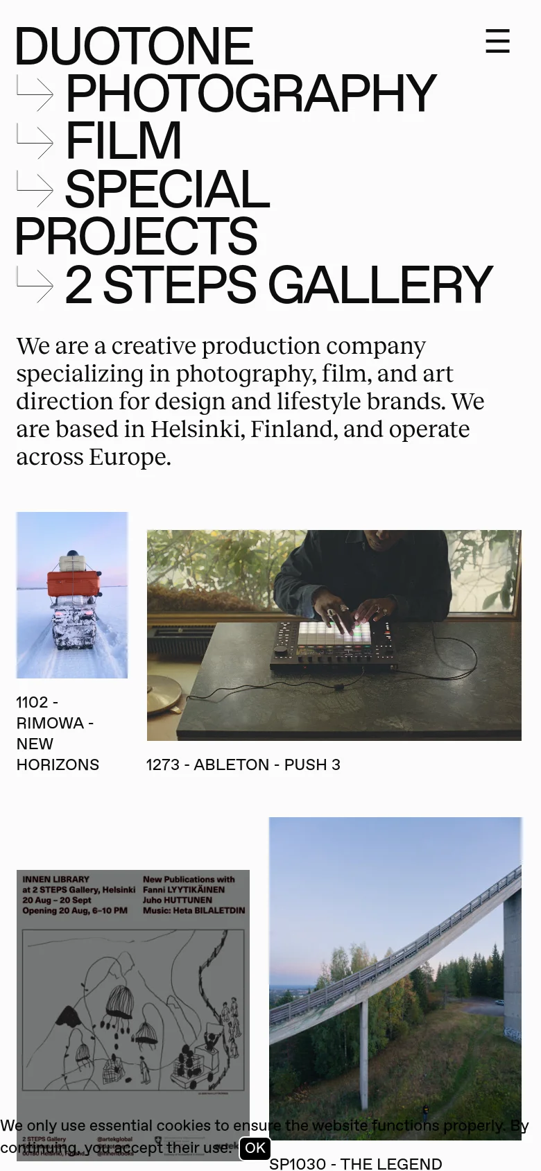 The mobile version maintains the minimalist white and black aesthetic but rearranges the layout for a vertical scroll. The large text links are stacked vertically, and the top navigation is condensed into a hamburger menu icon in the upper right. The project image grid is scaled to fit the narrower screen width, and a cookie consent banner appears at the bottom.