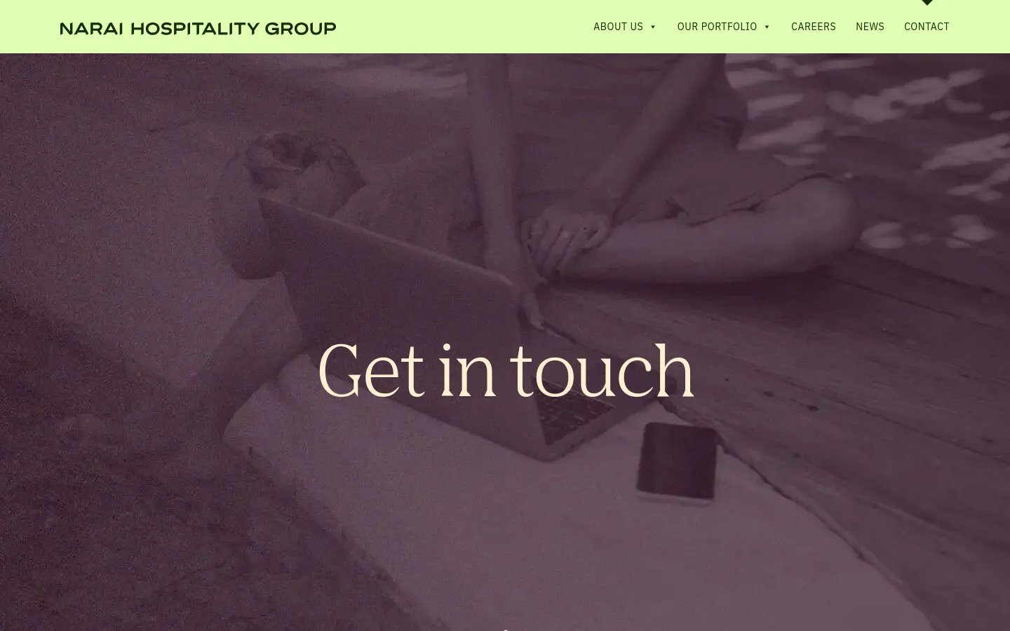 The desktop contact page features a light green navigation bar with the Narai Hospitality Group logo and menu links. A large hero section shows a muted, dark purple-toned image of a person using a laptop on a beach with the headline 'Get in touch' centered in white serif text.