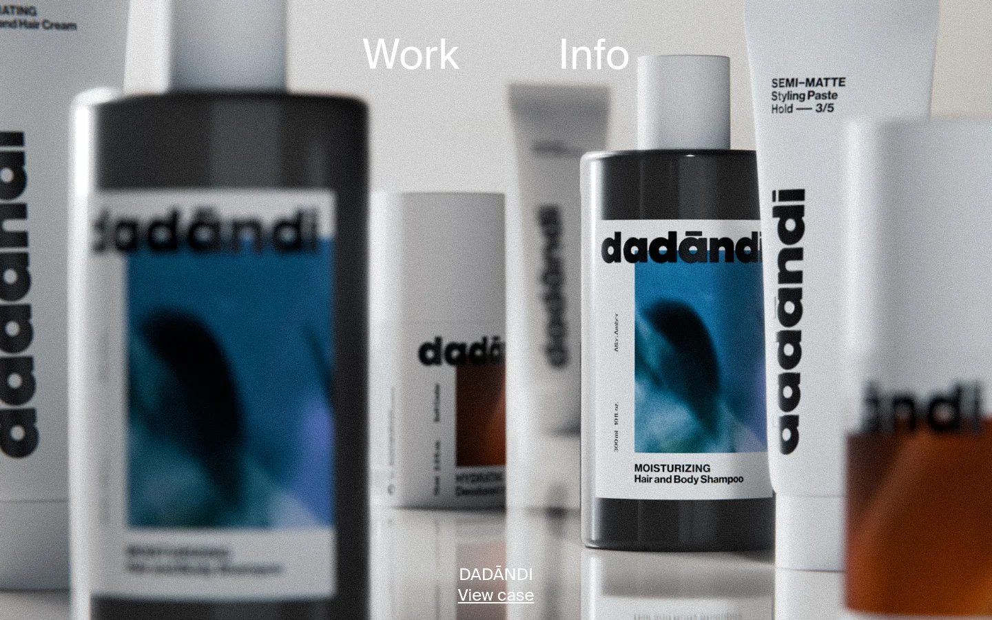 The desktop homepage features a large, high-quality hero image of various Dadāndi hair care products in dark and white packaging. Overlaid on the image are the navigation links 'Work' and 'Info' in white text, and at the bottom, the project title 'DADĀNDI' with a 'View case' call to action.