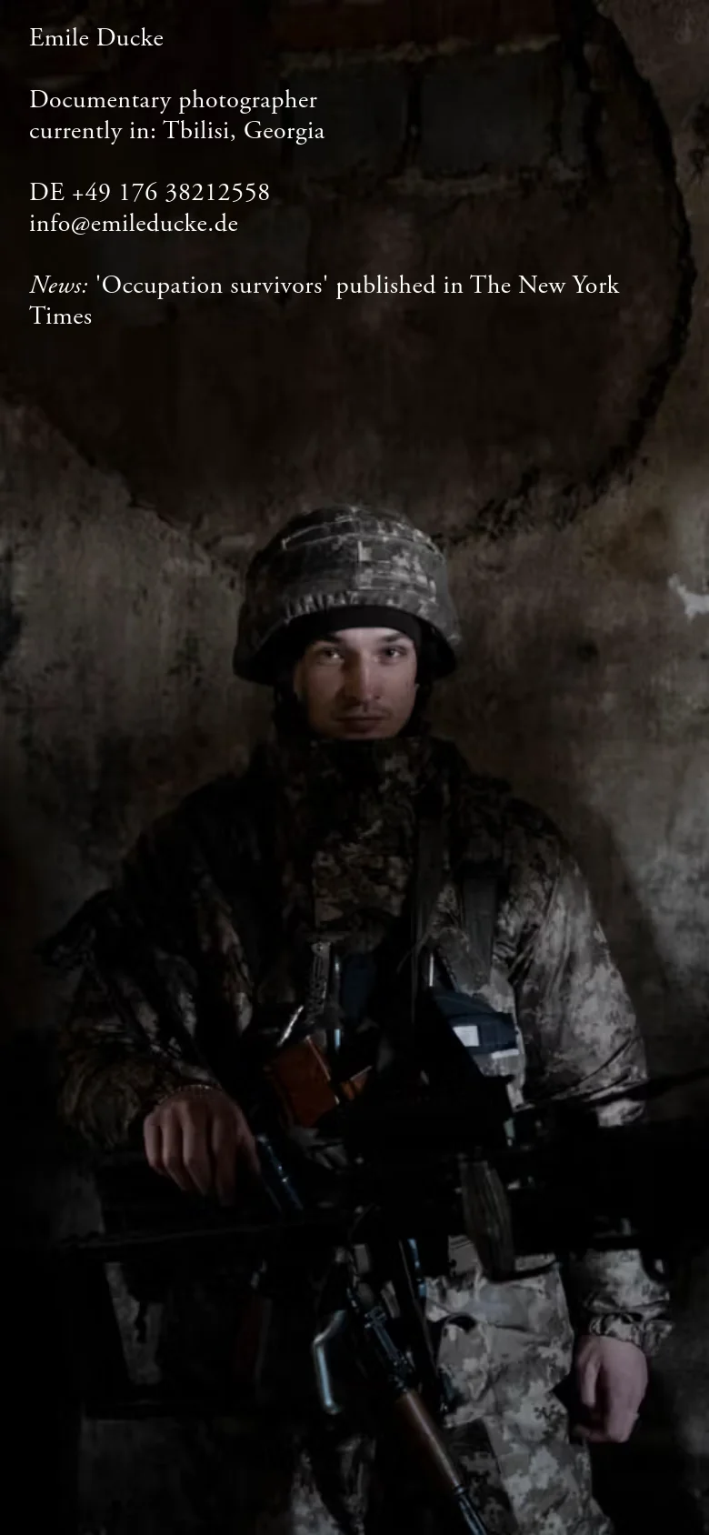 The mobile version maintains the dark, atmospheric hero image of a soldier but scales the text to fit the narrower screen. The contact information and news headline are stacked vertically at the top of the image for readability on a small device.