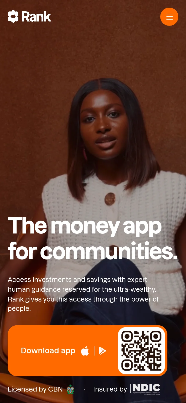 Mobile version of the Rank homepage featuring a close-up portrait of a woman as the hero background. The headline 'The money app for communities' and descriptive text are centered in white, with a large, prominent orange 'Download app' button at the bottom that includes a QR code and app store icons. The navigation is simplified to a logo and a hamburger menu icon at the top.