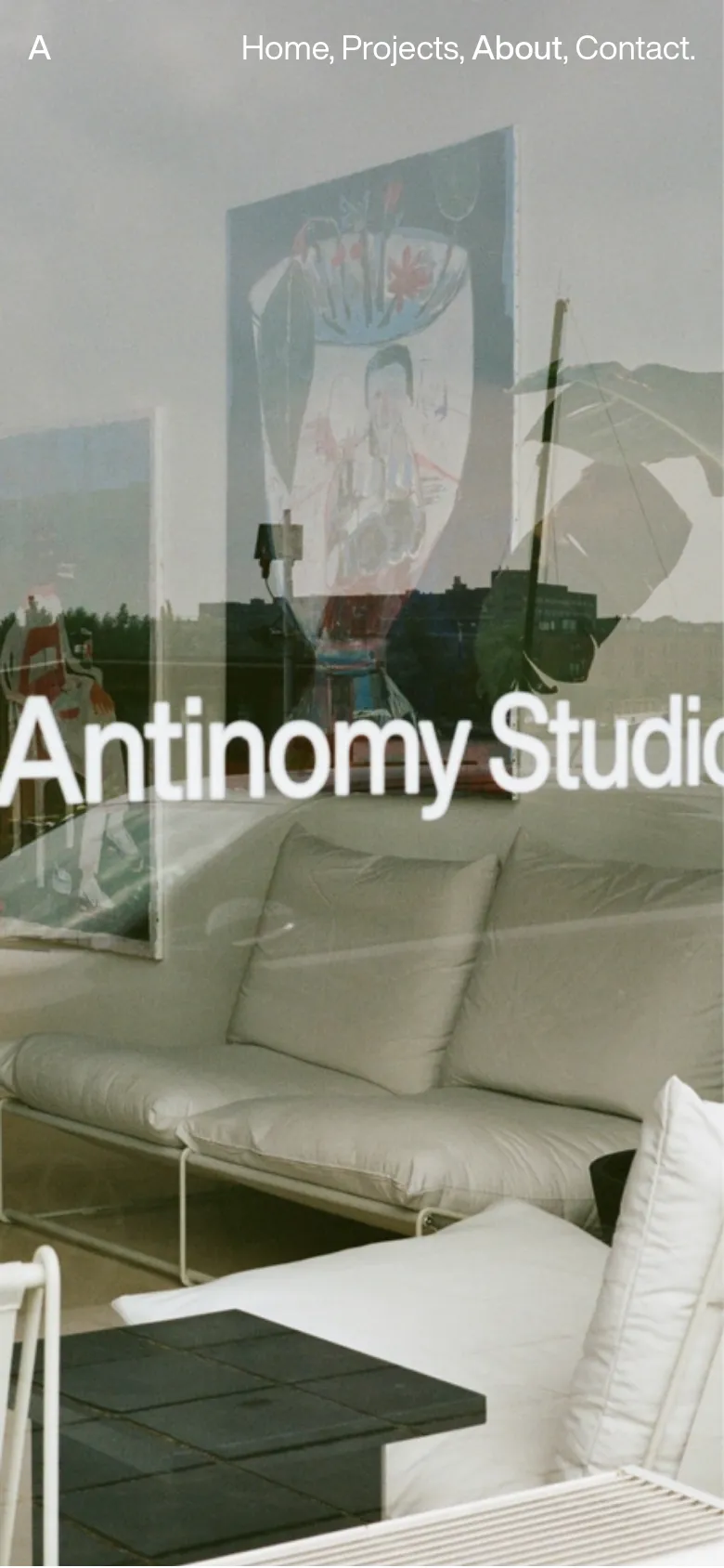 The mobile version maintains the minimalist aesthetic but uses a single-column vertical layout. The hero image is cropped tighter to the center, and the text content, client logos, and award lists are stacked vertically for easier scrolling on a narrow screen.