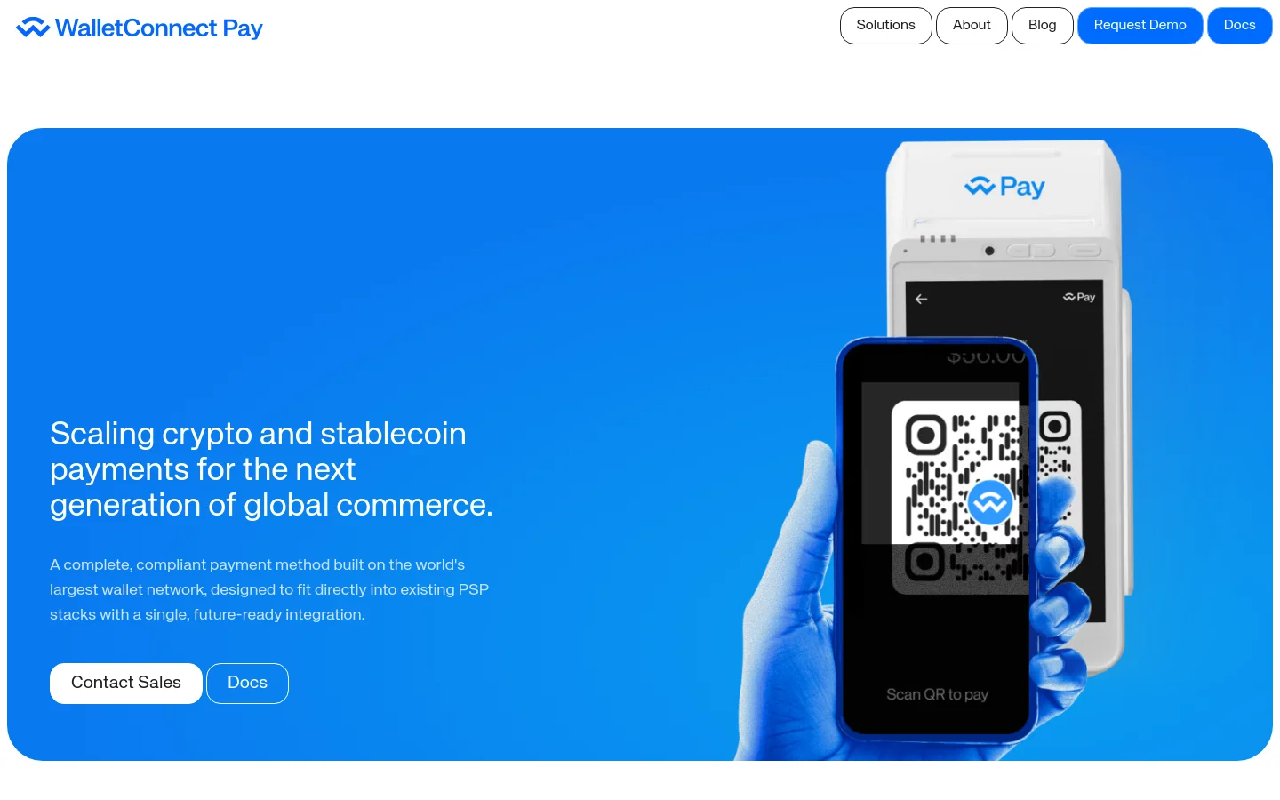 The desktop homepage features a large blue hero section with the headline 'Scaling crypto and stablecoin payments for the next generation of global commerce.' To the right, a hand holds a smartphone displaying a QR code in front of a white payment terminal. Navigation includes links for Solutions, About, Blog, Request Demo, and Docs, with primary call-to-action buttons for 'Contact Sales' and 'Docs' positioned below the subtext.