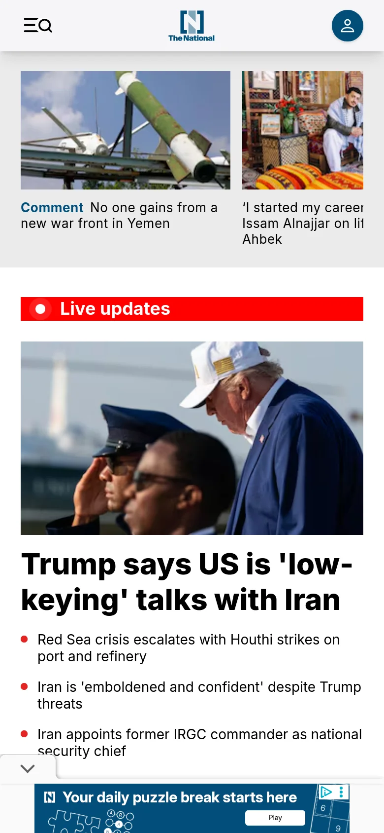 The mobile version presents a vertically stacked layout optimized for small screens, with the logo and a hamburger menu icon at the top. The 'Live updates' red banner and large headline about Trump dominate the upper viewport, followed by news cards that span the width of the screen. A small advertisement banner for puzzles is visible at the bottom of the view.