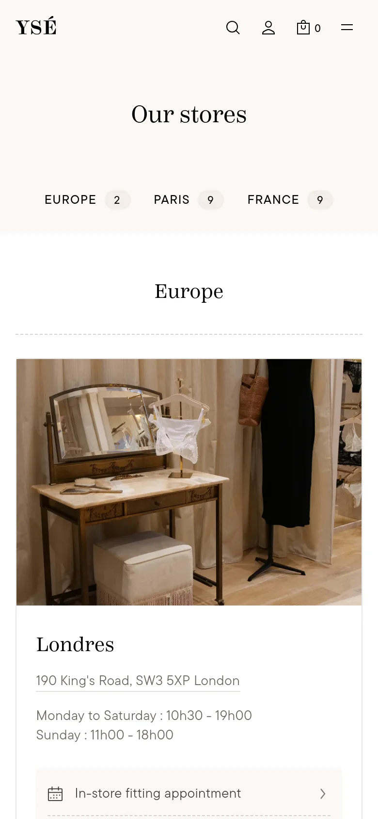The mobile version presents a single-column layout with a centered 'Our stores' heading and region filters. Store locations are displayed as large vertical cards featuring a boutique interior photo, the city name, address, and opening hours, with a prominent button for booking an in-store fitting appointment.