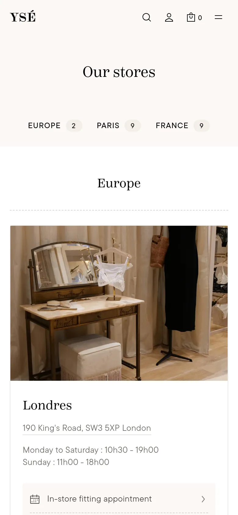 The mobile version presents a single-column layout with a centered 'Our stores' heading and region filters. Store locations are displayed as large vertical cards featuring a boutique interior photo, the city name, address, and opening hours, with a prominent button for booking an in-store fitting appointment.