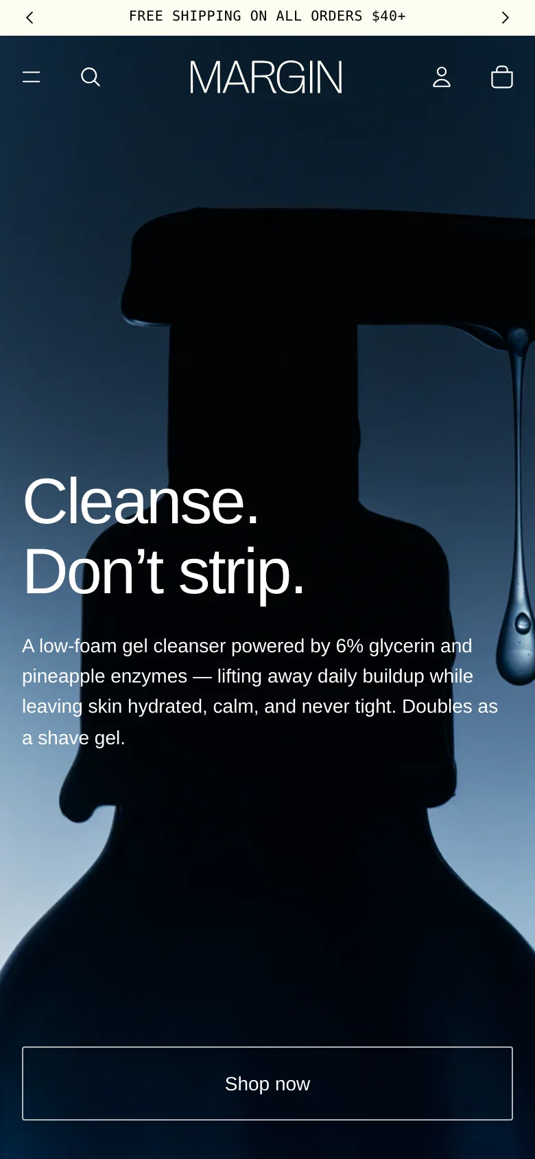 The mobile version maintains the dark blue color palette and the large hero image of the liquid droplet, but the layout is vertically stacked for a smaller screen. The navigation is condensed into a hamburger menu icon on the left, with the search, account, and bag icons on the right. The headline and 'Shop now' button are centered and scaled to fit the narrow viewport.