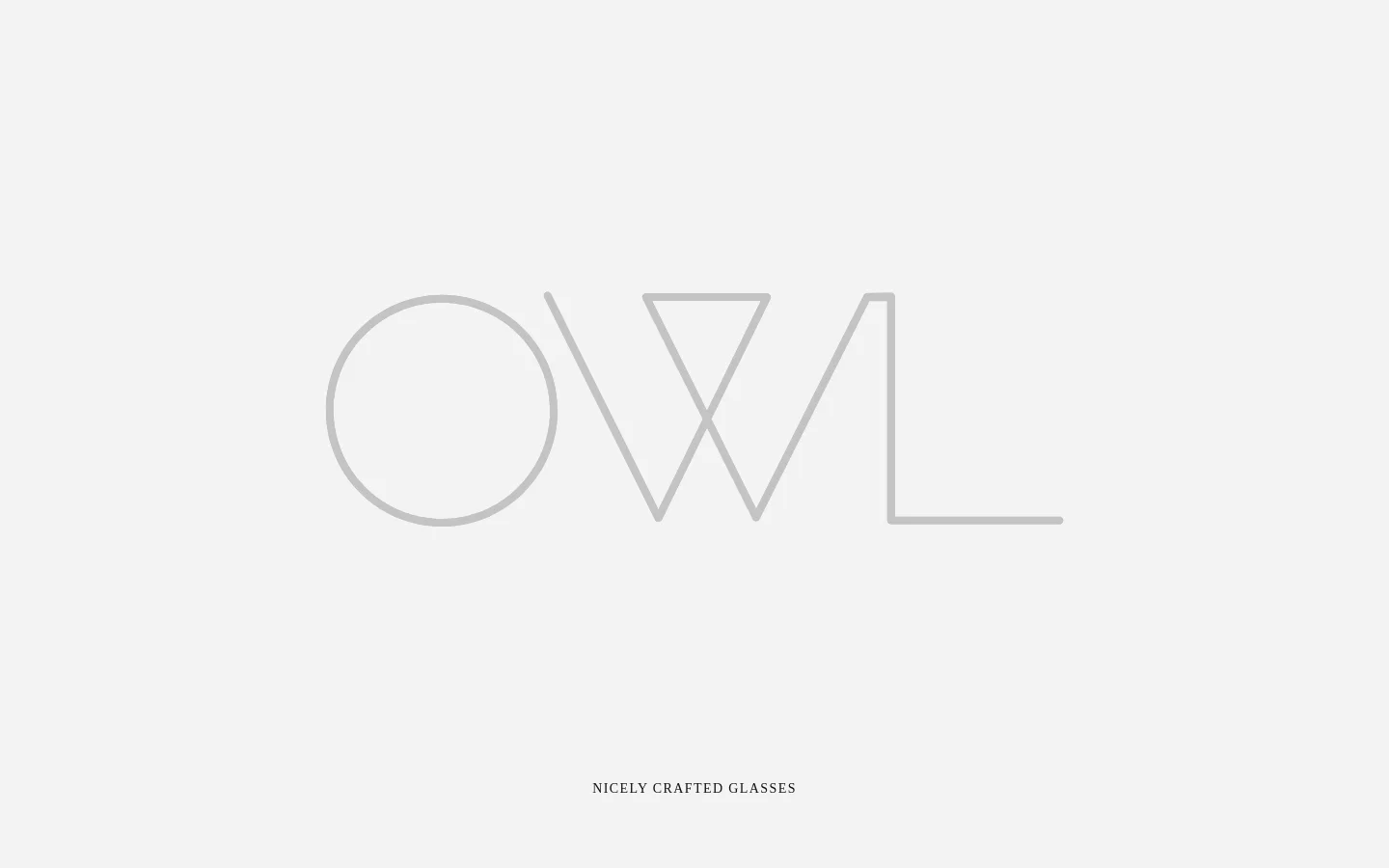 The desktop homepage features a minimalist design with a large, light gray 'OWL' logo centered on a pale background. Below the logo, the headline 'Nicely Crafted Glasses' is displayed, and the navigation includes links for Shop, Lookbook, About, and FAQ. The layout is spacious and airy, using a neutral color palette with clean typography.