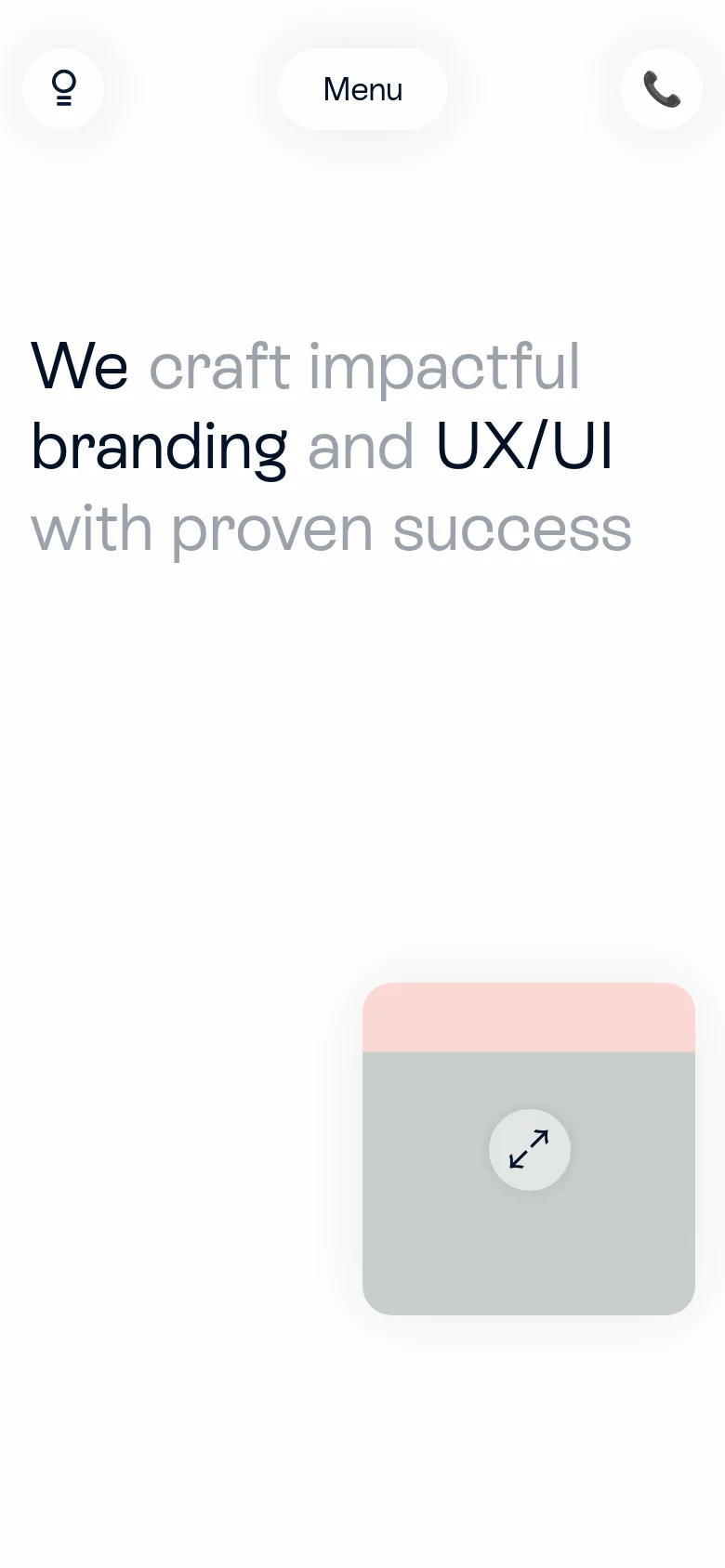 The mobile version presents a simplified layout with a centered 'Menu' button and two circular icons for a lightbulb and a telephone call. The hero headline is stacked vertically in large, bold black and grey text. A single, large light-grey card with an expansion icon sits below the text, replacing the horizontal layout seen on desktop.