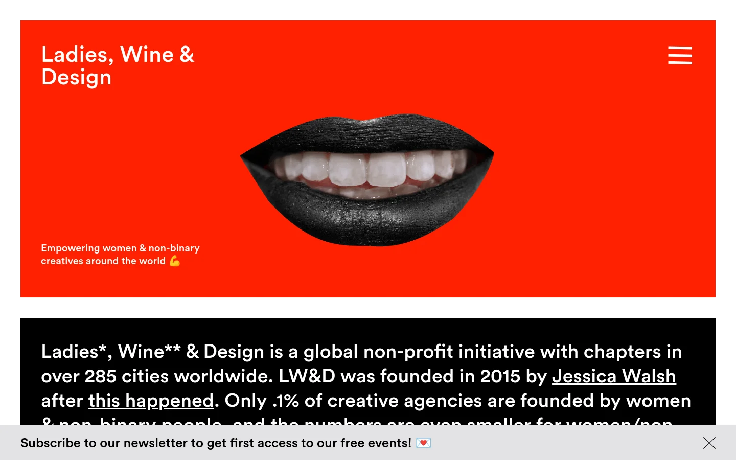 The desktop homepage features a bold red header with the title 'Ladies, Wine & Design' and a hamburger menu icon. A large, centered hero image shows a close-up of dark-painted lips revealing white teeth, accompanied by the text 'Empowering women & non-binary creatives around the world 🤌'. Below the red header, a black section contains white text explaining the initiative's mission.