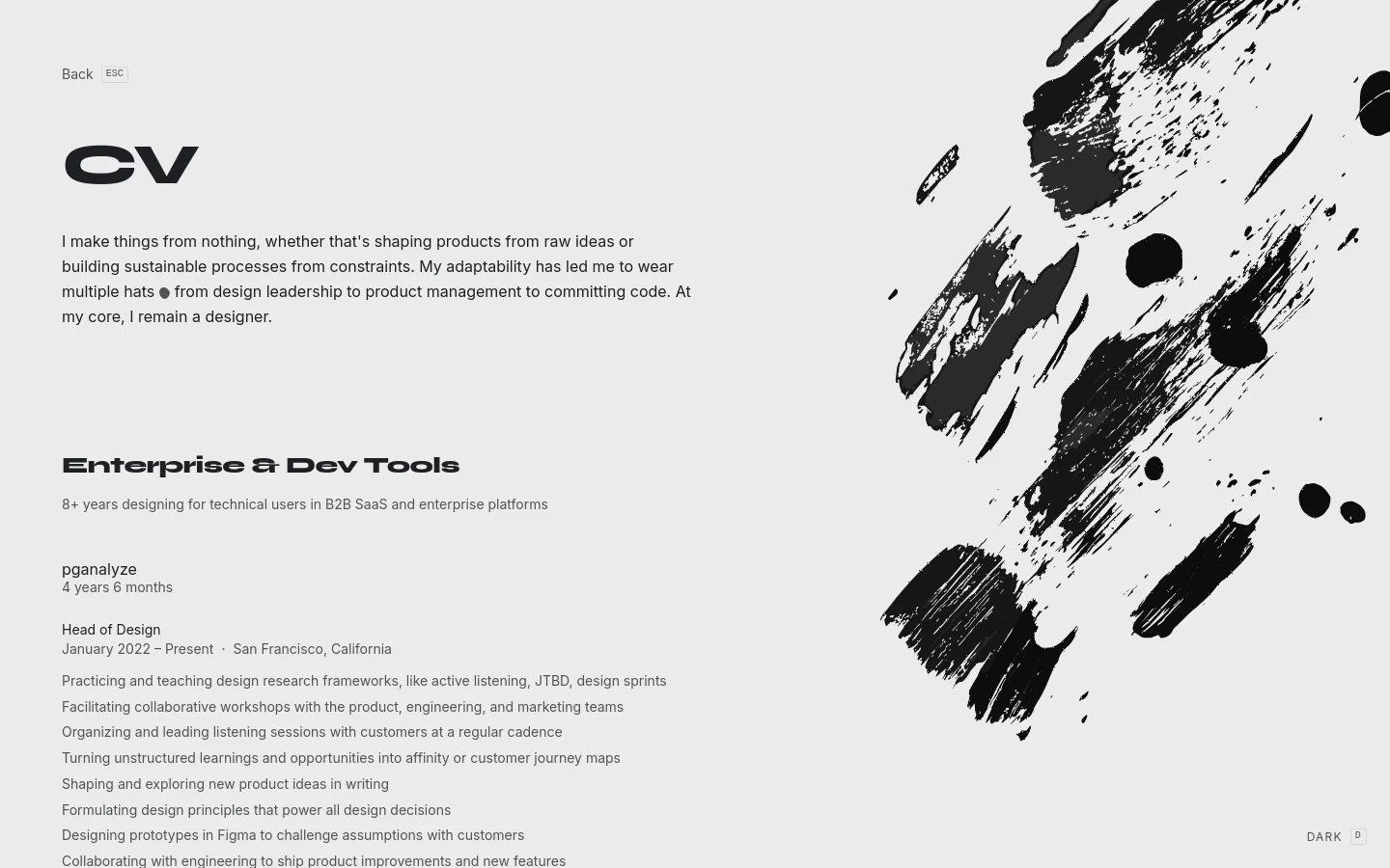 A minimalist CV page with a clean white background and large black typography. The layout features a large 'CV' heading, a personal mission statement, and a professional history section under the heading 'Enterprise & Dev Tools'. A large, expressive black ink-splatter graphic dominates the right side of the screen.