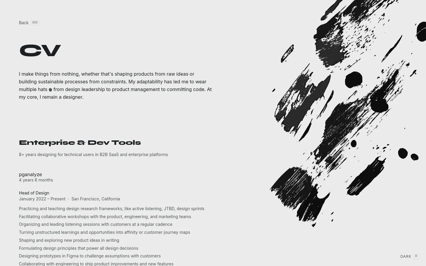 A minimalist CV page with a clean white background and large black typography. The layout features a large 'CV' heading, a personal mission statement, and a professional history section under the heading 'Enterprise & Dev Tools'. A large, expressive black ink-splatter graphic dominates the right side of the screen.