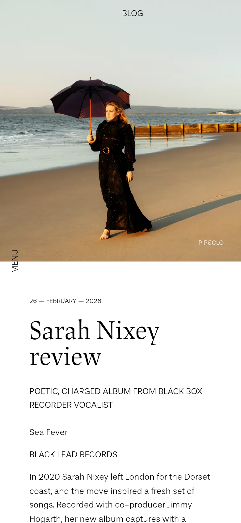 The mobile version uses a single-column vertical layout. The hero image of the woman on the beach spans the top of the screen, followed by the blog title, date, and the Sarah Nixey review headline and text below it.
