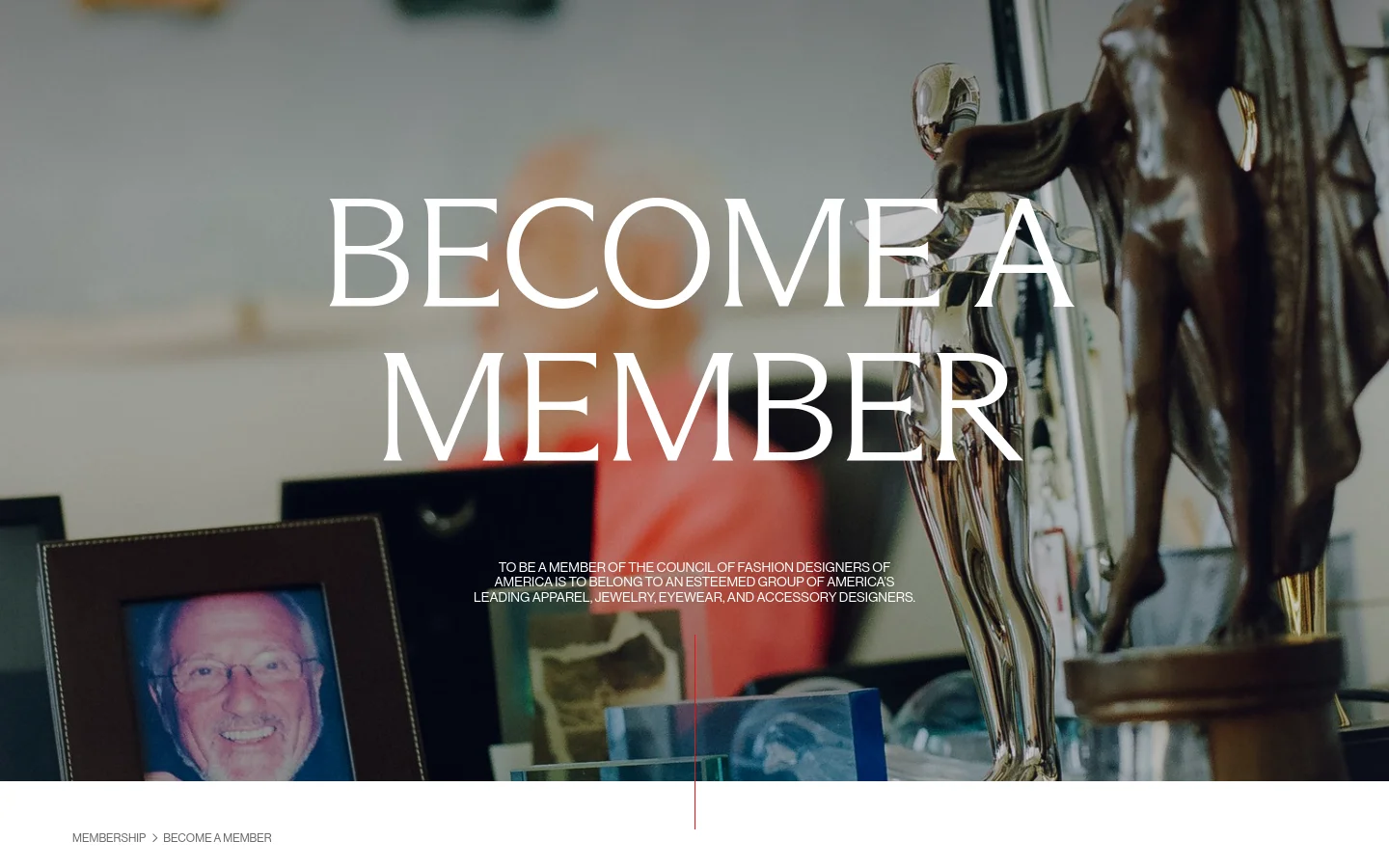 The desktop page features a large hero image with the headline 'BECOME A MEMBER' in white serif text over a blurred background of fashion awards and a framed photograph. Below the hero section, a clean white layout contains text regarding CFDA history, membership eligibility, and the application process. A thin red vertical line serves as a subtle design element near the bottom of the hero image.