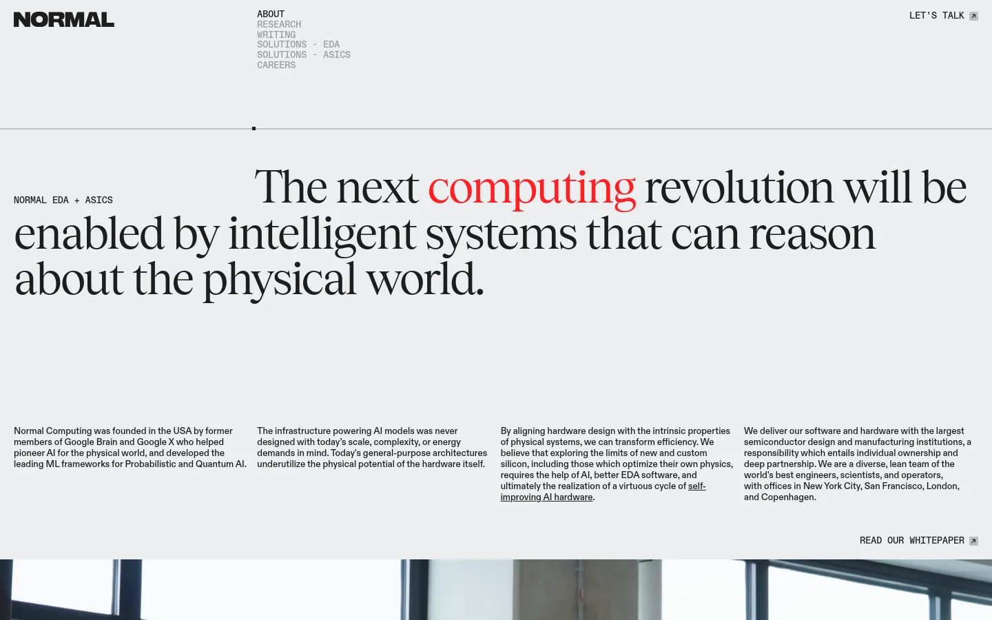 The desktop About page features a minimalist design with a white background and black serif typography. A large hero headline reads 'The next computing revolution will be enabled by intelligent systems that can reason about the physical world,' with the word 'computing' highlighted in red. Below the headline, the page is organized into four columns of text describing the company's mission, origins, and approach to AI hardware.