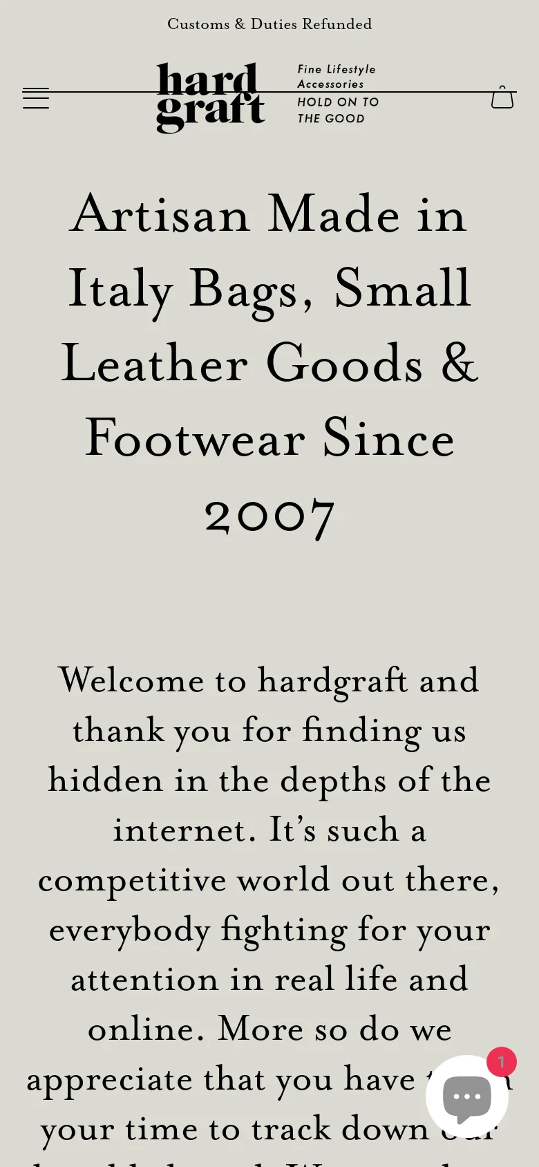 The mobile version maintains the minimalist aesthetic and centered serif text but utilizes a condensed layout. The navigation is simplified with a hamburger menu icon on the left, the brand logo in the center, and a shopping bag icon on the right. A floating chat icon is visible in the bottom right corner.