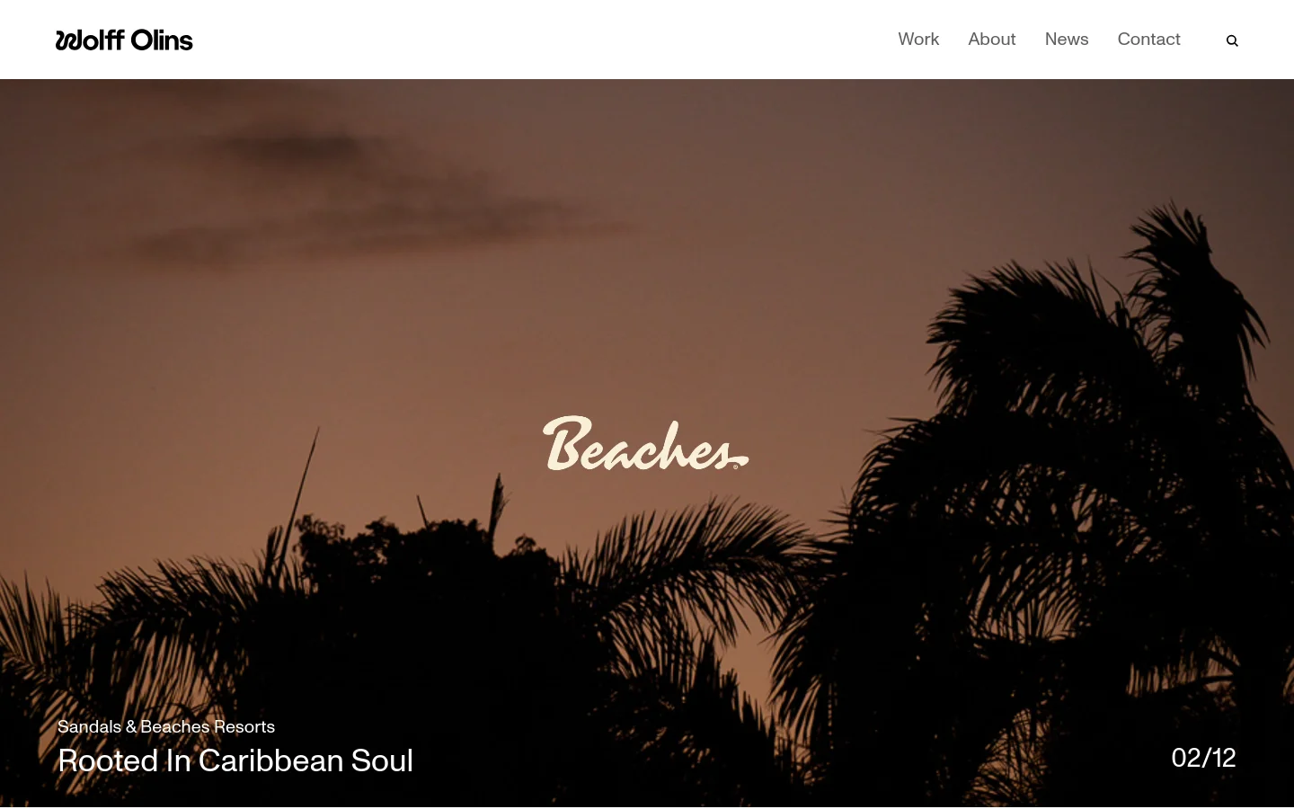 The Wolff Olins homepage features a minimalist design with a large hero image of palm tree silhouettes against a warm sunset sky and the text 'Beaches. Rooted In Caribbean Soul'. A clean white navigation bar at the top includes the logo, links for Work, About, News, and Contact, and a search icon. Below the hero section, a grid of project tiles showcases various brand works with large imagery and bold headlines.