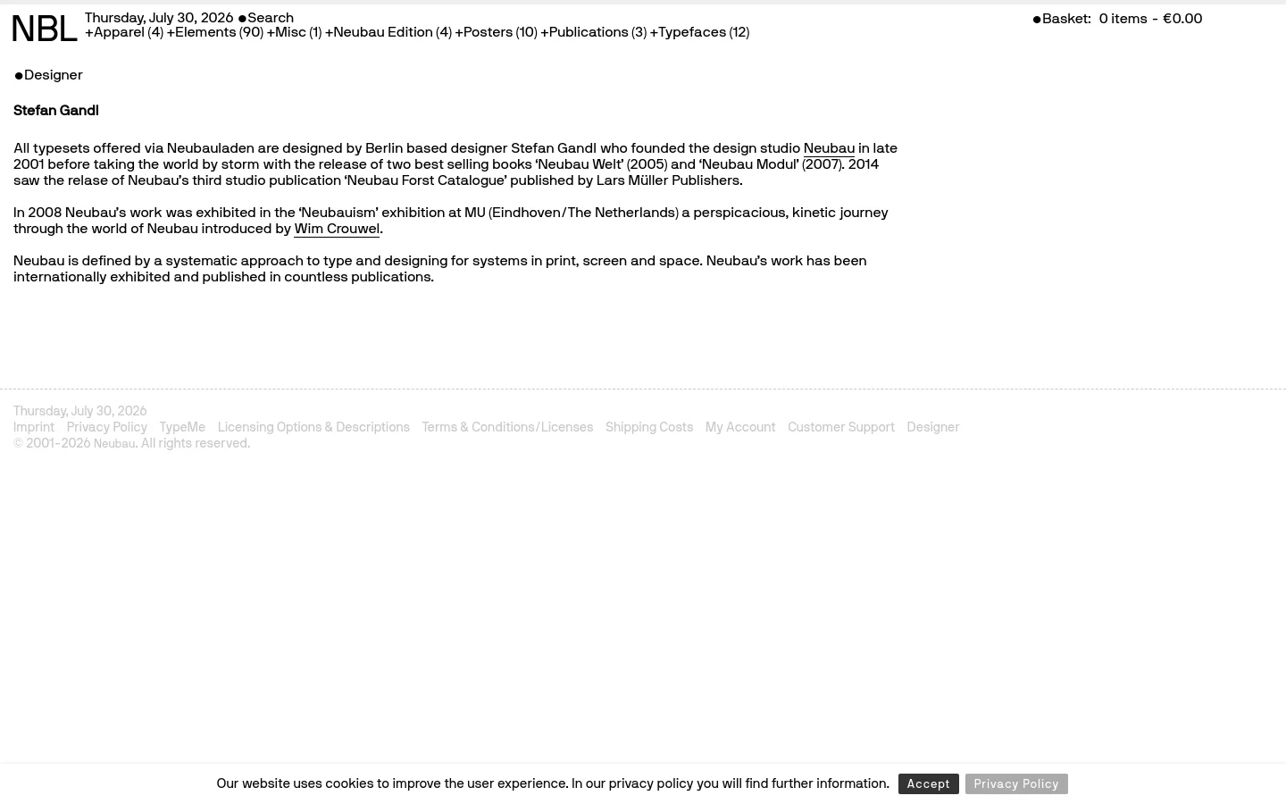 A minimalist desktop webpage with a white background and black sans-serif typography. The layout features a header with the date, a search function, and a shopping basket, followed by a large headline 'Designer' and a biographical text about Stefan Gandl. A simple footer contains site links and copyright information.