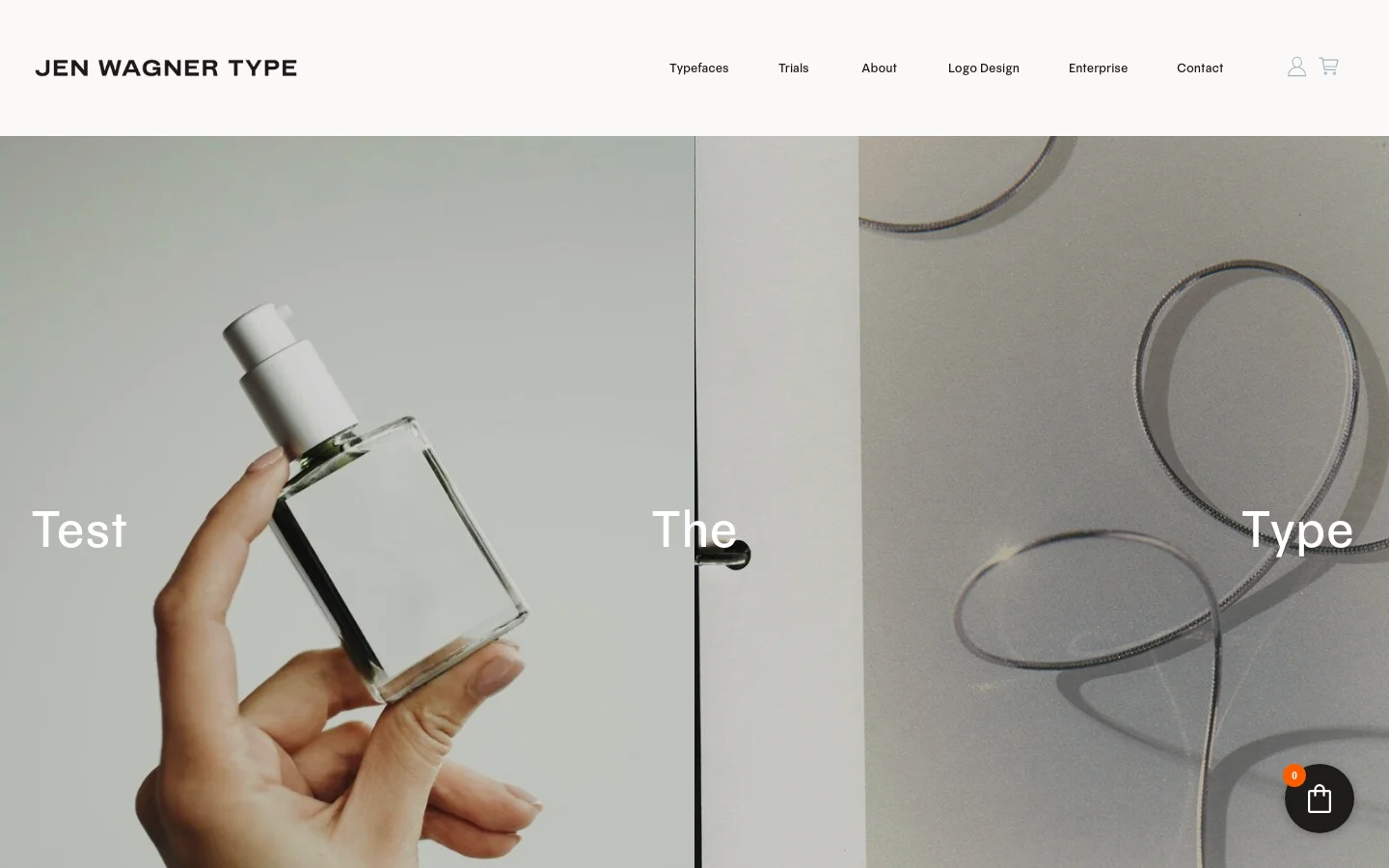 The desktop page features a minimalist design with a white header containing the 'JEN WAGNER TYPE' logo and navigation links for Typefaces, Trials, About, Logo Design, Enterprise, and Contact. The hero section consists of a large, split-screen lifestyle image showing a hand holding a glass perfume bottle next to a silver snake chain necklace, overlaid with the large white text 'Test The Type'.