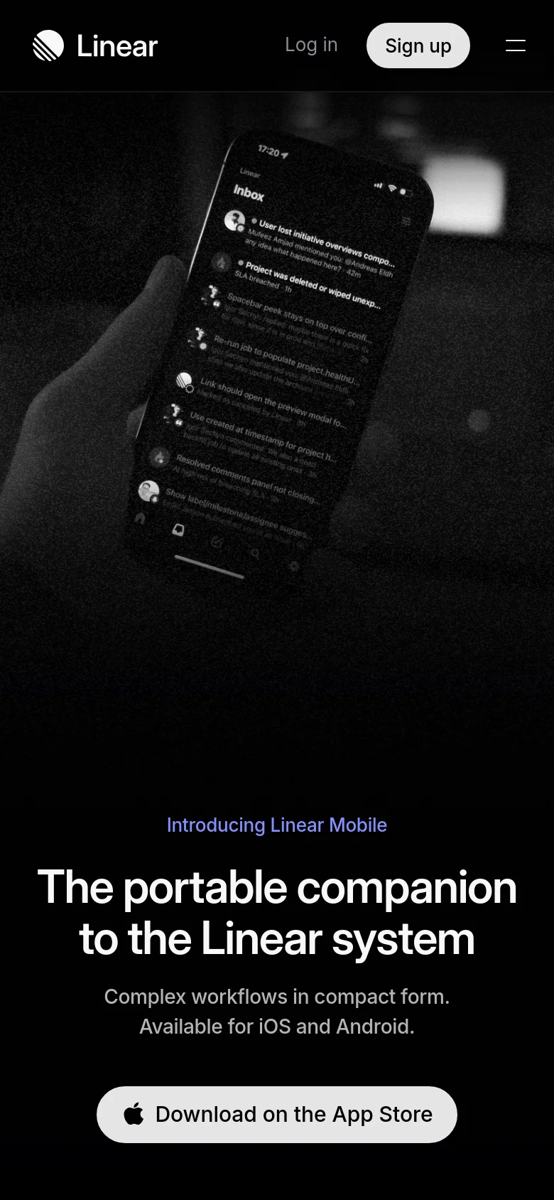 The mobile version presents a vertically stacked layout with the cinematic smartphone image at the top. The headline and subheadline are centered below the image, followed by a single prominent white call-to-action button to 'Download on the App Store'. The navigation is simplified to a logo, 'Log in', 'Sign up', and a hamburger menu icon.