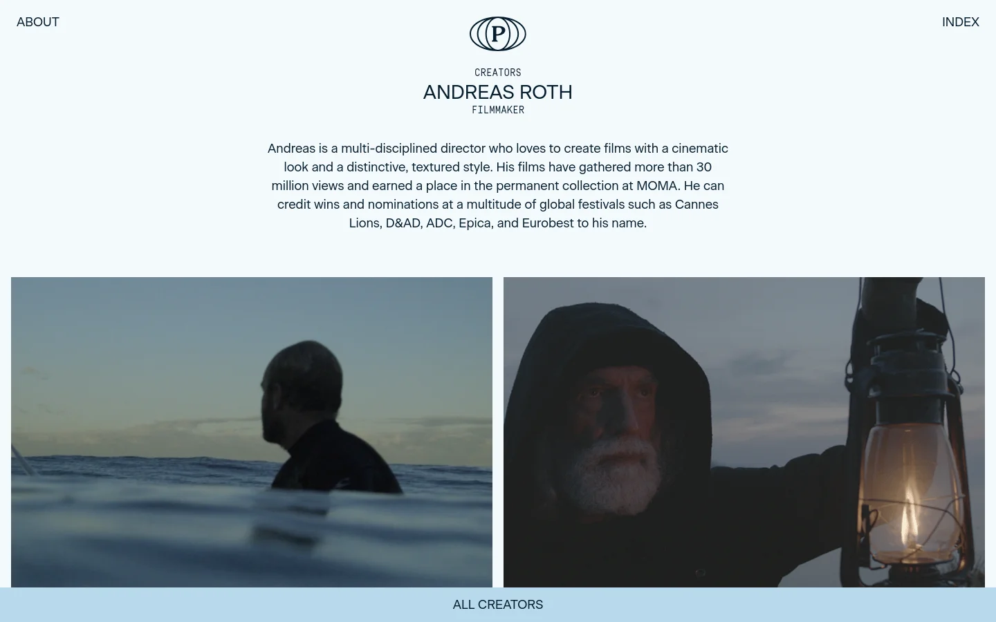 The desktop page features a minimalist white background with a centered logo and navigation links for 'ABOUT' and 'INDEX'. A large heading introduces filmmaker Andreas Roth, followed by a biographical paragraph and a wide cinematic hero image split into two panels showing a man in the sea and a close-up of a bearded man holding a lantern. A light blue footer contains the 'ALL CREATORS' call to action.