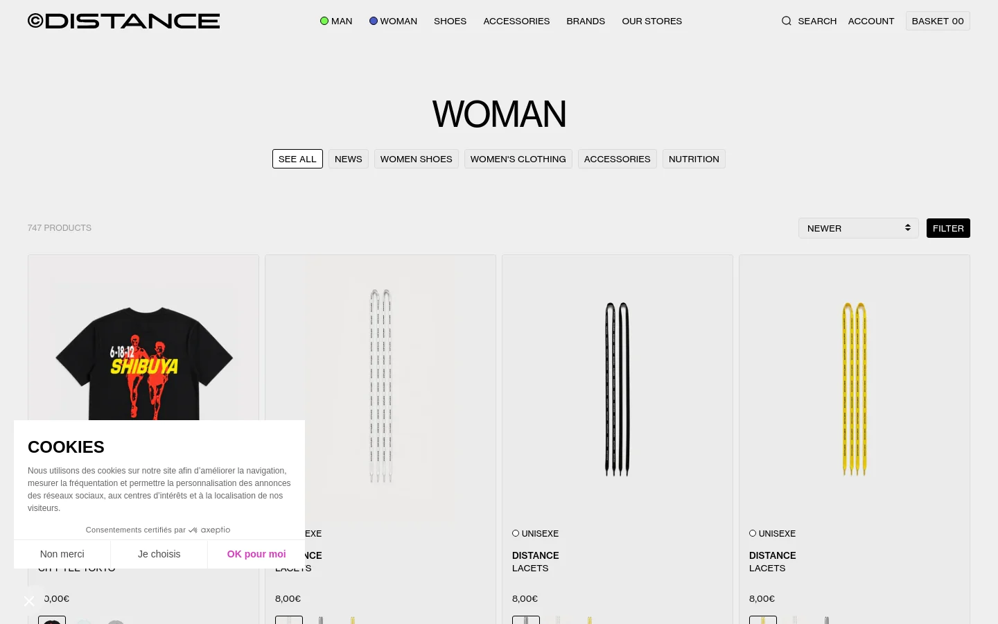 The desktop version of the Woman collection page features a minimalist white background with the large heading 'WOMAN' and a horizontal navigation menu including links for News, Women Shoes, and Accessories. A product grid displays items like the 'City Tee Tokyo' and shoelaces, each with pricing and color options. A cookie consent banner is visible in the lower-left corner.