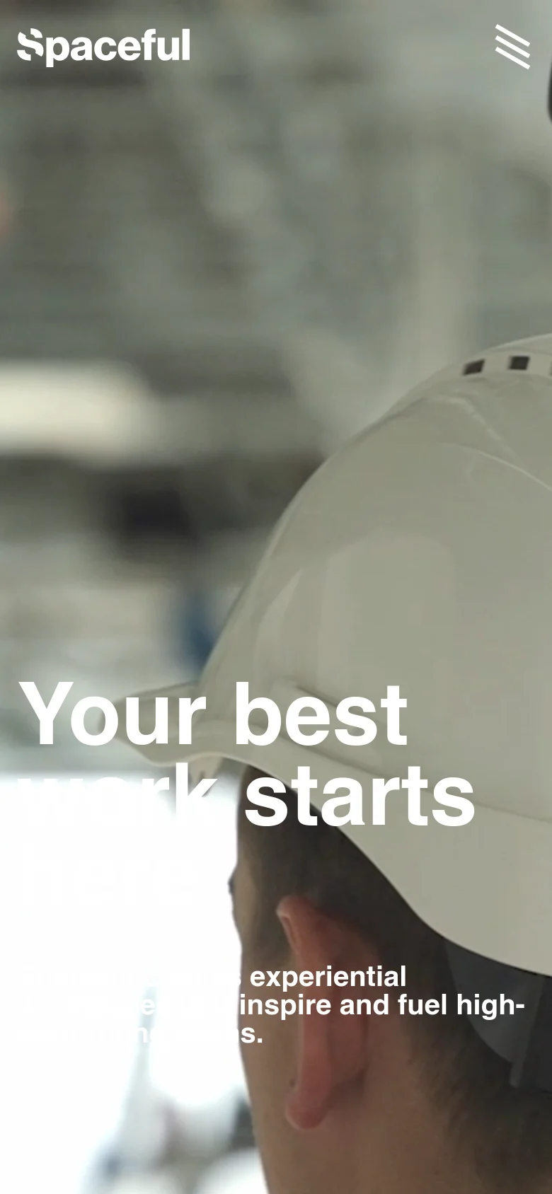 The mobile version presents a vertically oriented hero image of a person wearing a white hard hat, with the headline 'Your best work starts here' centered in large white text. The top navigation is condensed into a white hamburger menu icon in the upper right corner, while the Spaceful logo remains in the upper left.