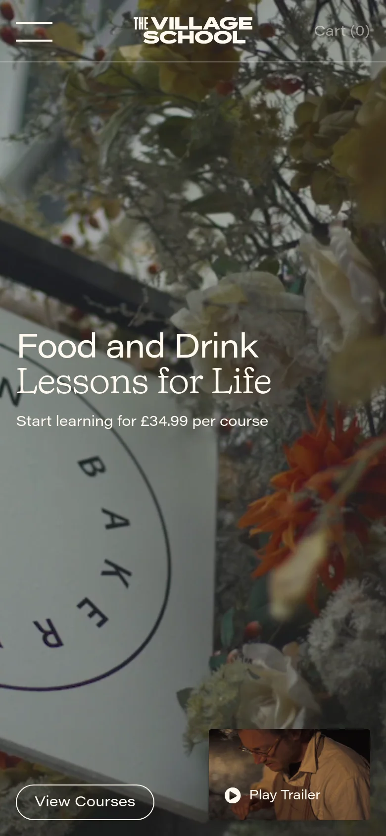The mobile version presents a vertically oriented hero section with the headline 'Food and Drink Lessons for Life' over a floral background. The layout is simplified with a hamburger menu on the left, the logo centered, and 'Cart (0)' on the right. Primary actions include a 'View Courses' button at the bottom left and a 'Play Trailer' button at the bottom right.
