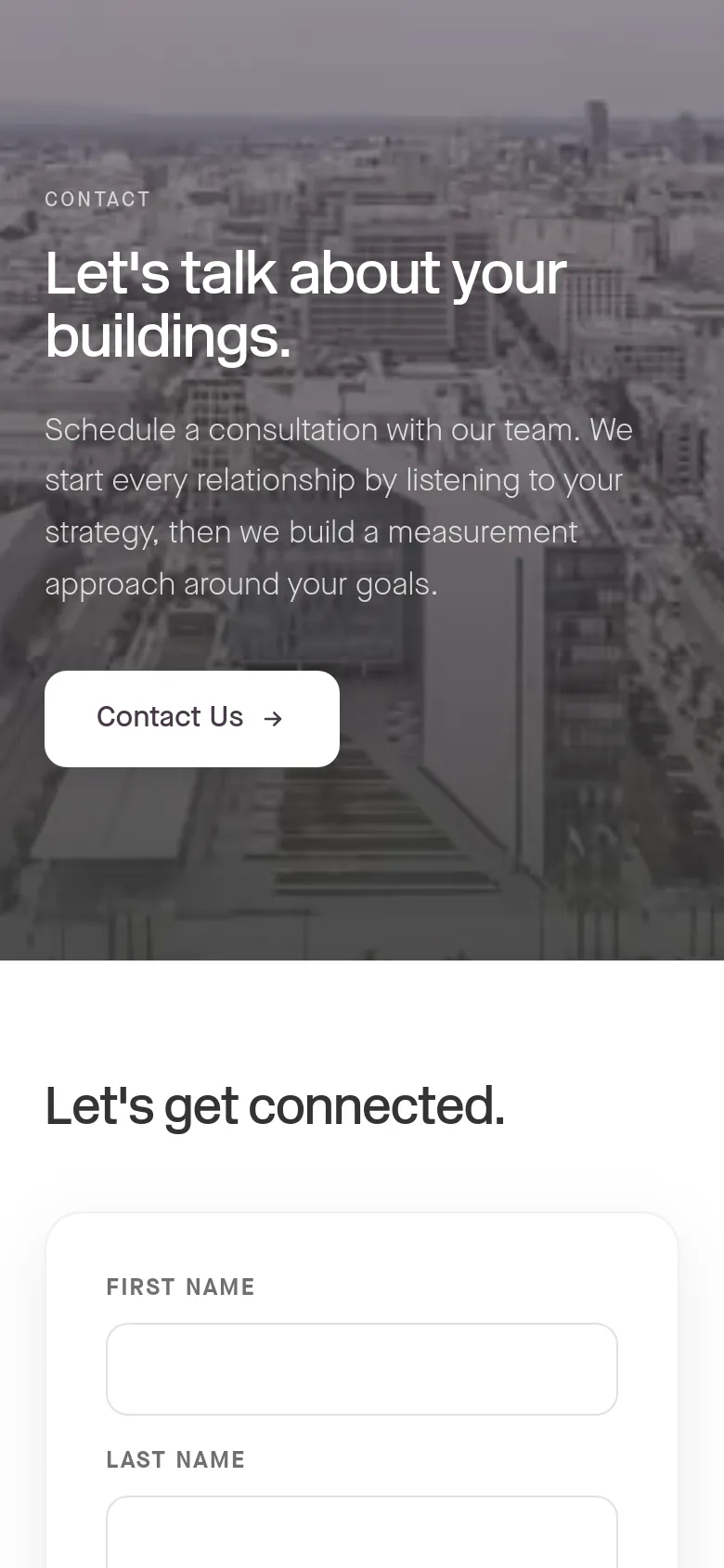 The mobile version maintains the grayscale cityscape hero image and text, but the layout is vertically stacked for a narrower screen. The headline and description are centered, and the contact form fields below appear larger and full-width to accommodate touch interaction.