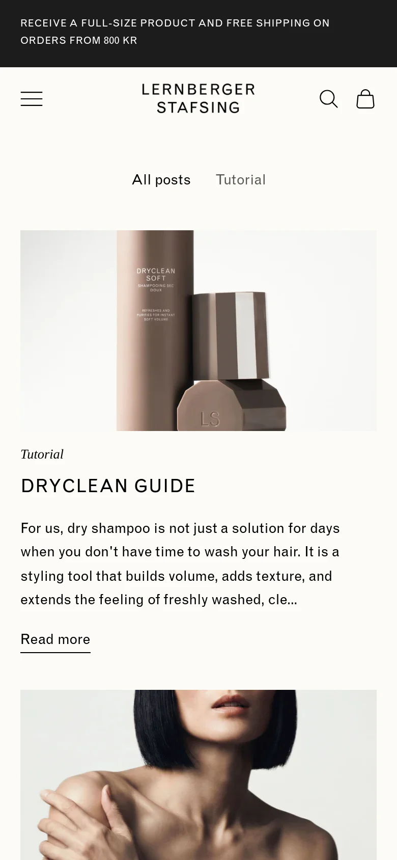 The mobile version maintains the minimalist aesthetic but uses a single-column vertical layout. The navigation menu is condensed into a hamburger icon, and the article cards are stacked vertically, showing one large image and its corresponding headline and text at a time.