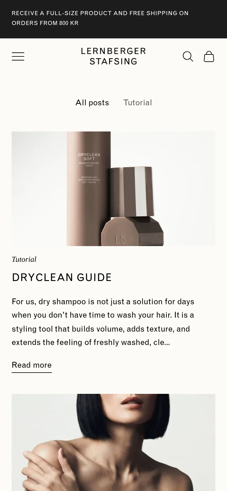 The mobile version maintains the minimalist aesthetic but uses a single-column vertical layout. The navigation menu is condensed into a hamburger icon, and the article cards are stacked vertically, showing one large image and its corresponding headline and text at a time.