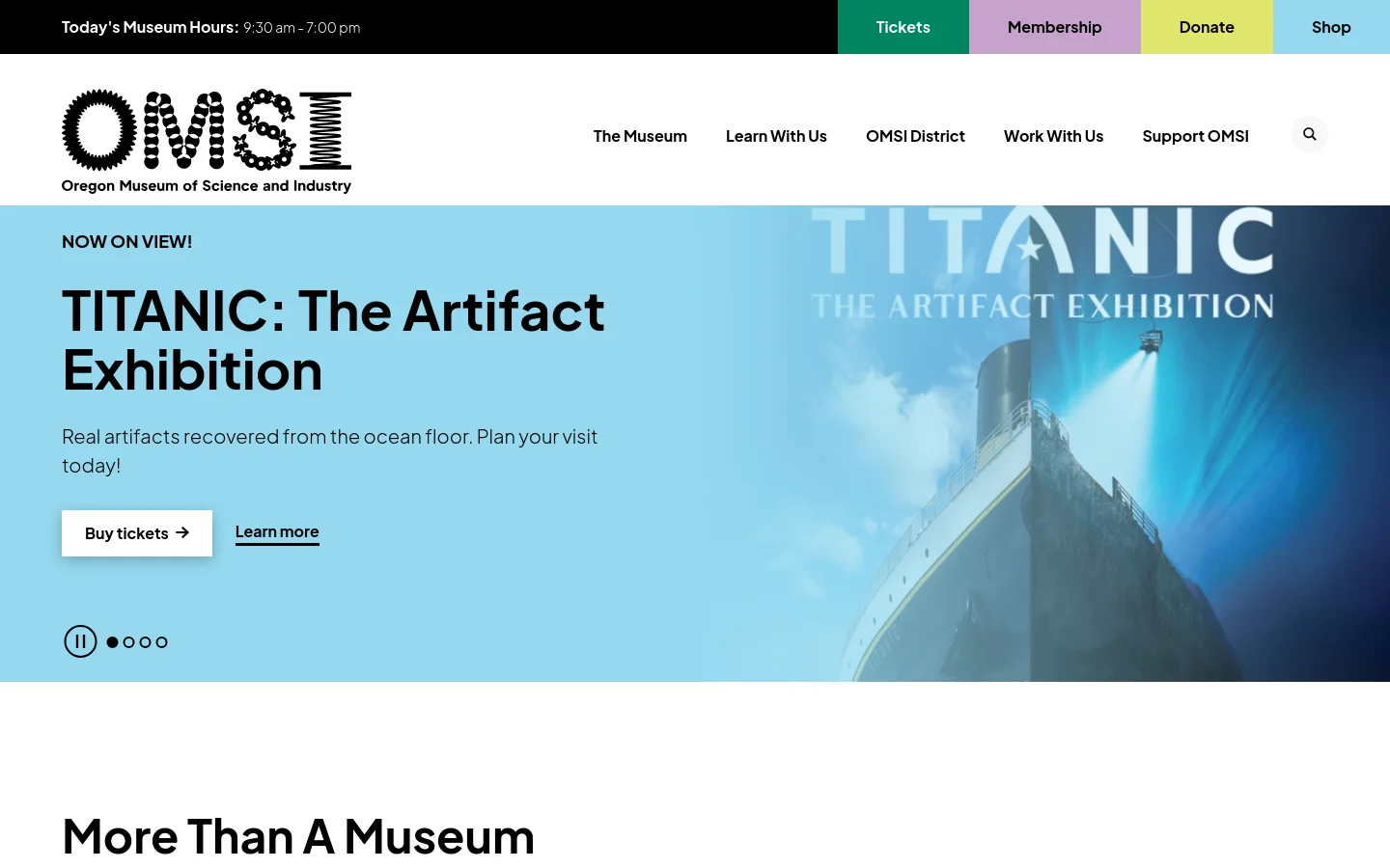 The OMSI homepage features a large hero image of the Titanic shipwreck under blue water with the headline 'TITANIC: The Artifact Exhibition'. The desktop layout includes a top utility bar with museum hours and colorful buttons for Tickets, Membership, Donate, and Shop, alongside a main navigation menu. A white background follows the hero section, starting with the heading 'More Than A Museum'.