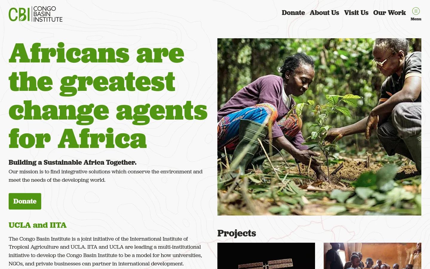 The desktop homepage features a large green headline, 'Africans are the greatest change agents for Africa,' set against a white background with subtle topographic line patterns. To the right is a large hero image of two people planting a sapling in a lush forest, and a green 'Donate' button sits below the introductory text. The navigation menu at the top includes links for Donate, About Us, Visit Us, and Our Work.