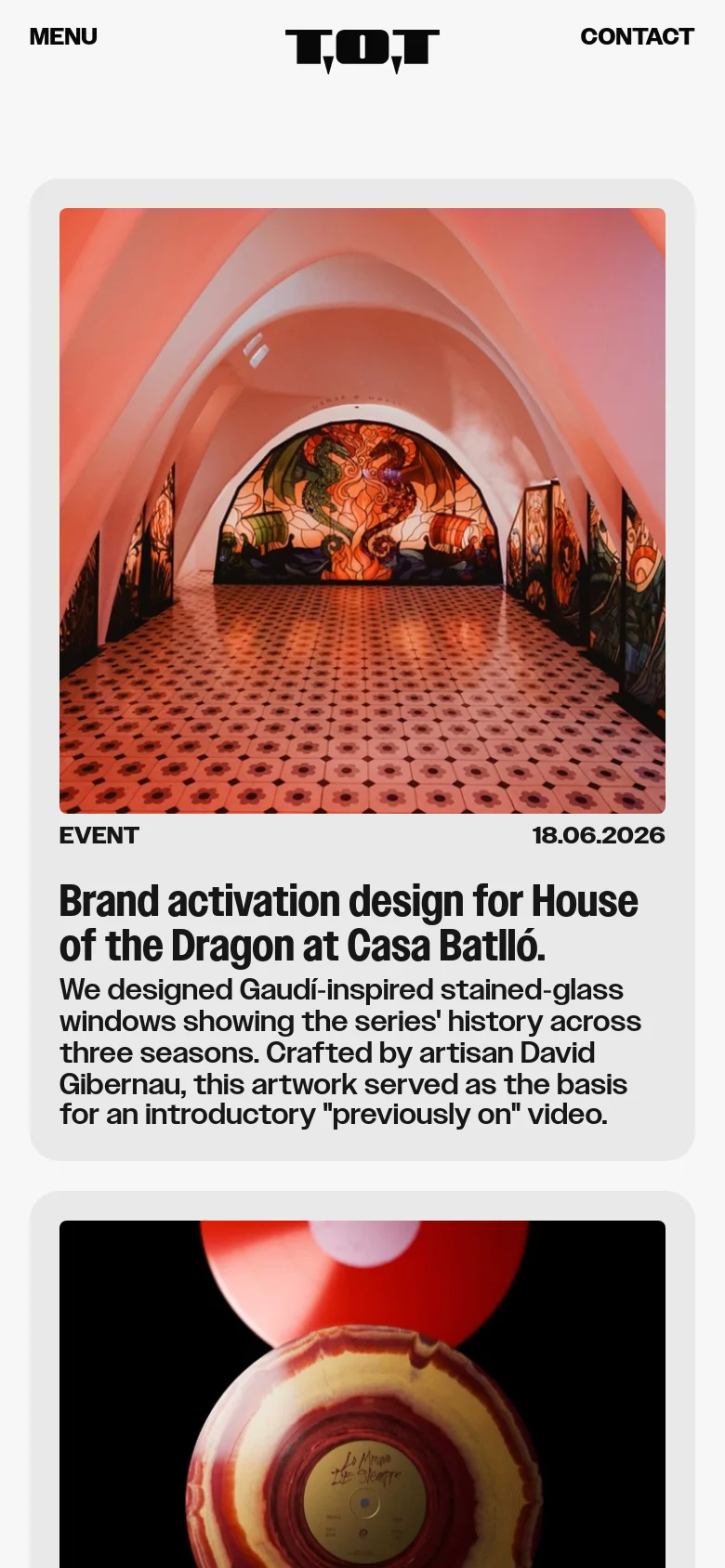 The mobile version displays the news content in a single-column vertical stack for easier scrolling. The navigation is simplified into a 'Menu' button on the left and a 'Contact' link on the right, flanking the central T.O.T logo.