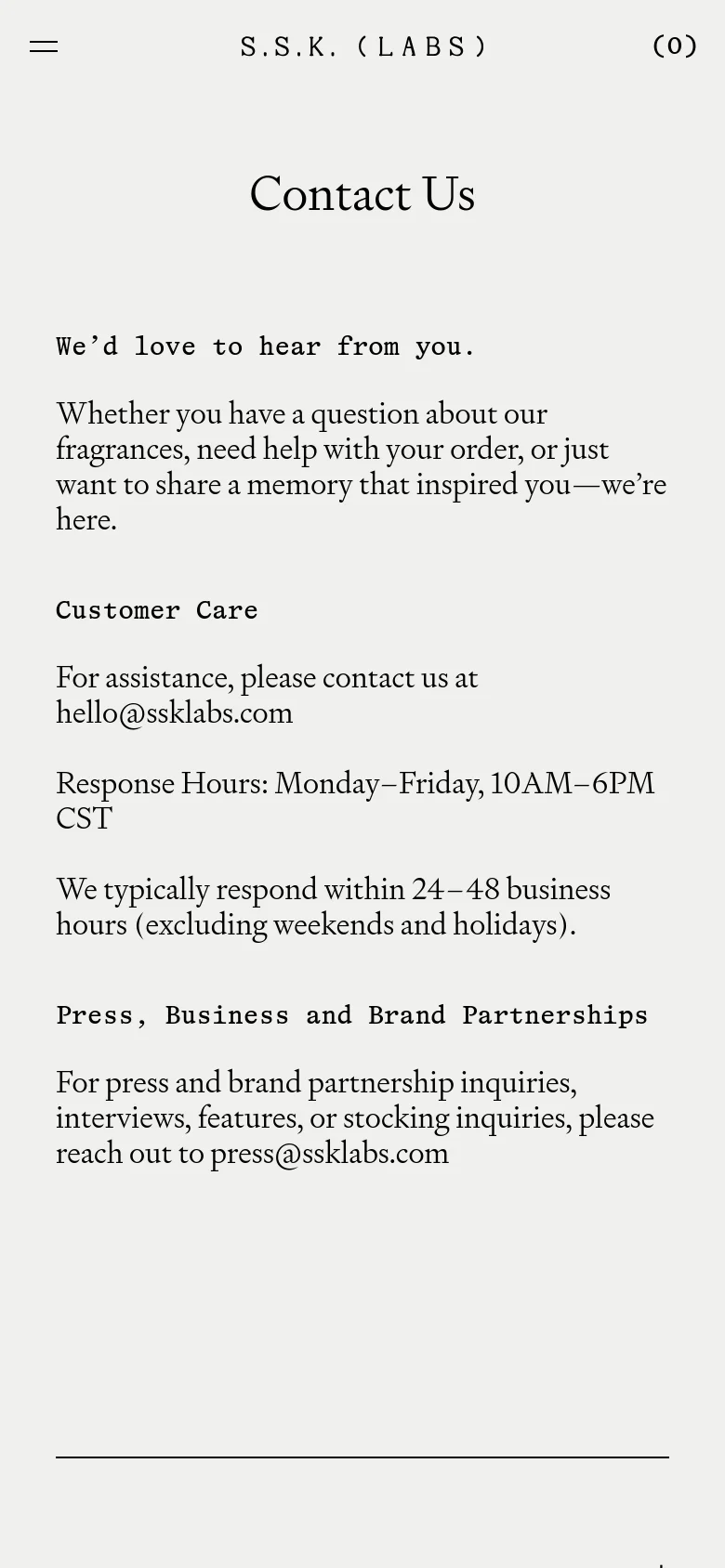 The mobile version maintains the minimalist beige and black aesthetic but uses a condensed layout. The top navigation is replaced by a hamburger menu icon on the left, the brand name in the center, and a cart icon on the right. The contact information and text sections are stacked vertically to fit the narrow screen width.