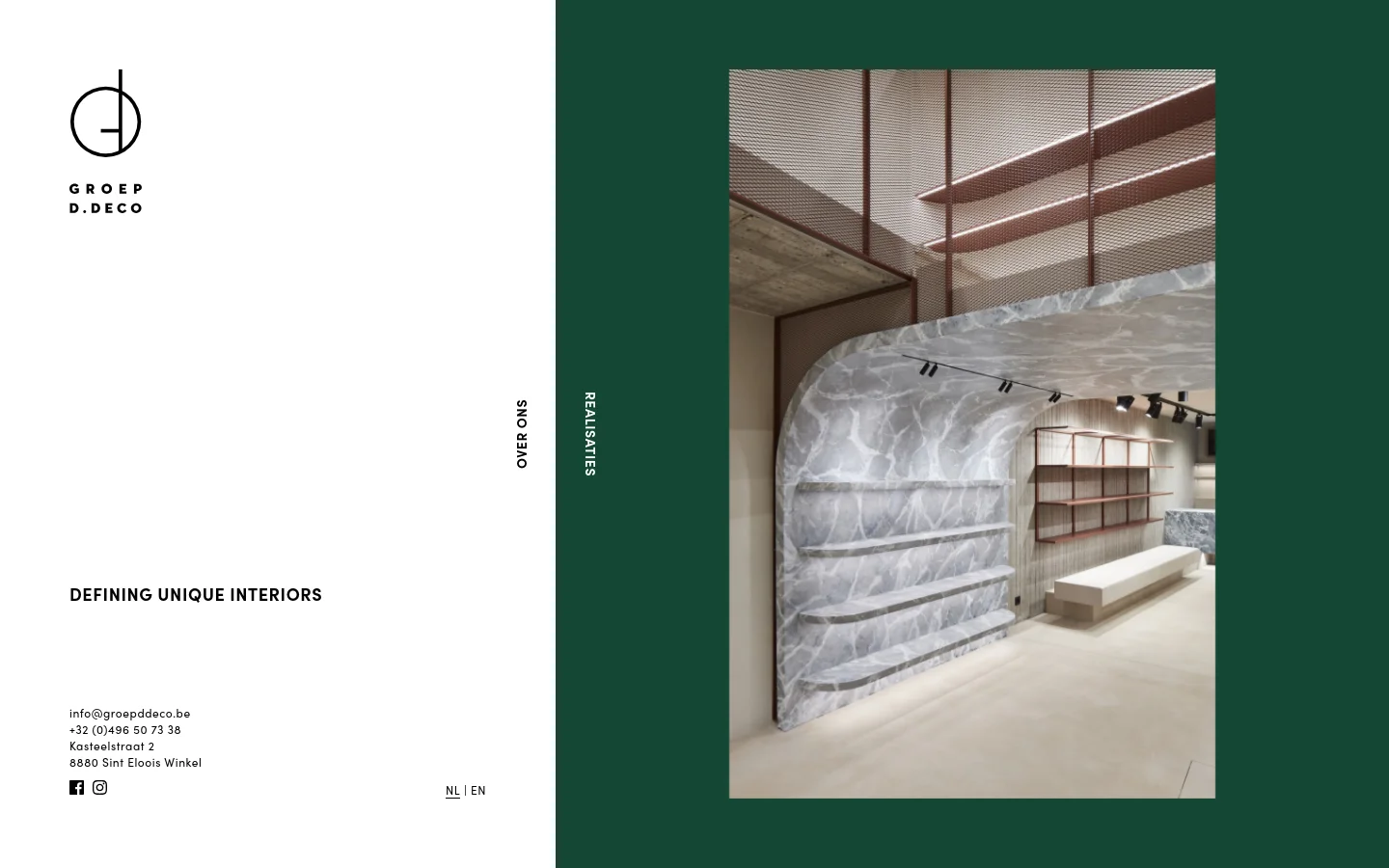 The desktop homepage features a minimalist split-screen layout with a white left side containing the Groep D.Deco logo, the headline 'DEFINING UNIQUE INTERIORS', contact information, and language selectors. The right side displays a large, high-quality photograph of a modern interior with marble-textured walls and wooden shelving against a deep green background.