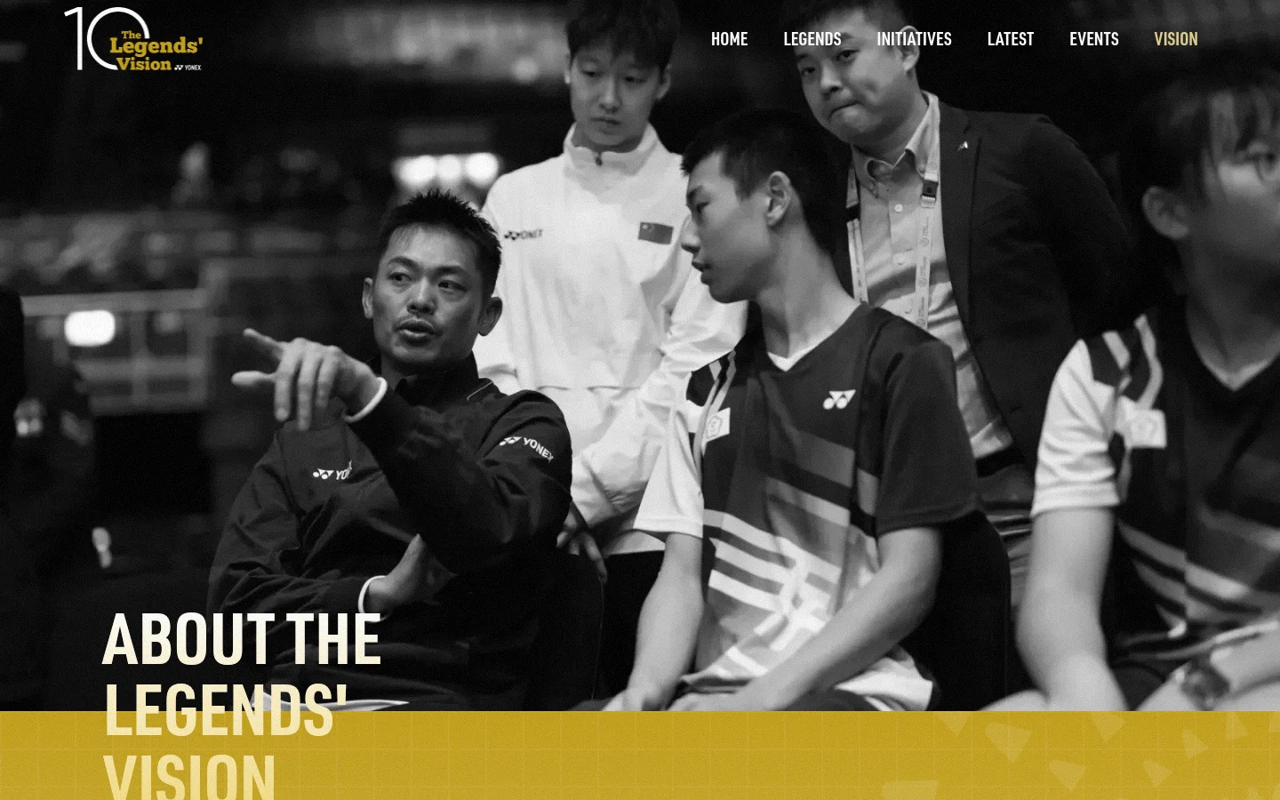 The desktop page features a large black and white hero image of badminton players with the headline 'ABOUT THE LEGENDS' VISION' in bold white text. A navigation menu is at the top right, and the layout uses a gold and white color scheme with sections for history, statistics, and a timeline. The design is spacious with large typography and high-contrast imagery.