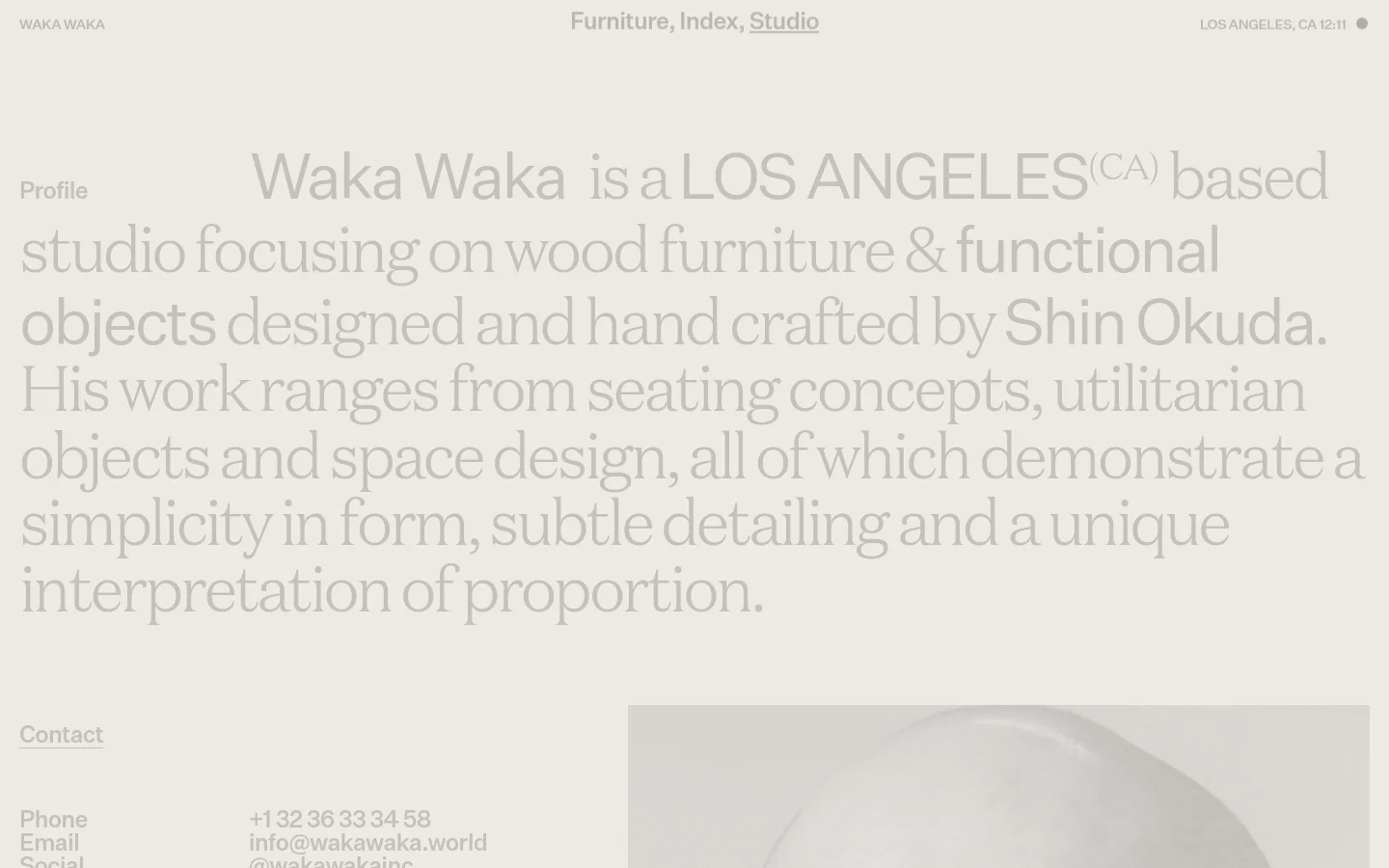 The desktop Studio page features a minimalist design with large, light gray serif typography set against an off-white background. A profile section describes the studio's focus on wood furniture, followed by contact details and a large vertical portrait of a man in black and white on the right side. The navigation menu at the top includes links for Furniture, Index, and Studio.