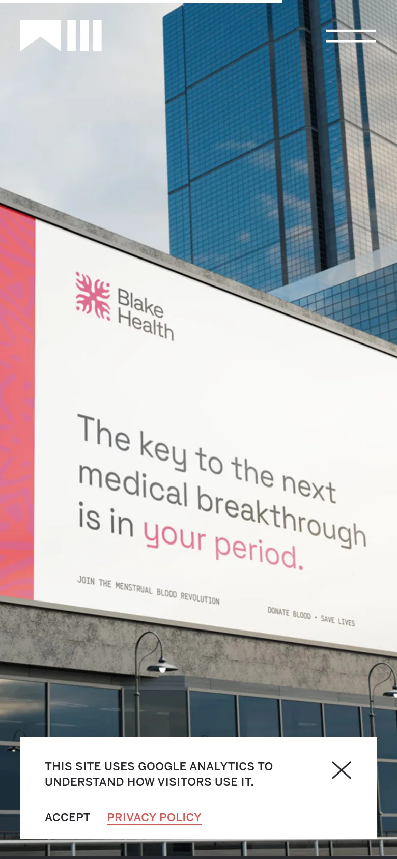 The mobile version displays a vertically oriented view of the same city billboard hero image, focusing on the 'Blake Health' advertisement. The navigation is simplified with a hamburger menu icon in the top right, and the cookie consent banner spans the bottom of the screen.