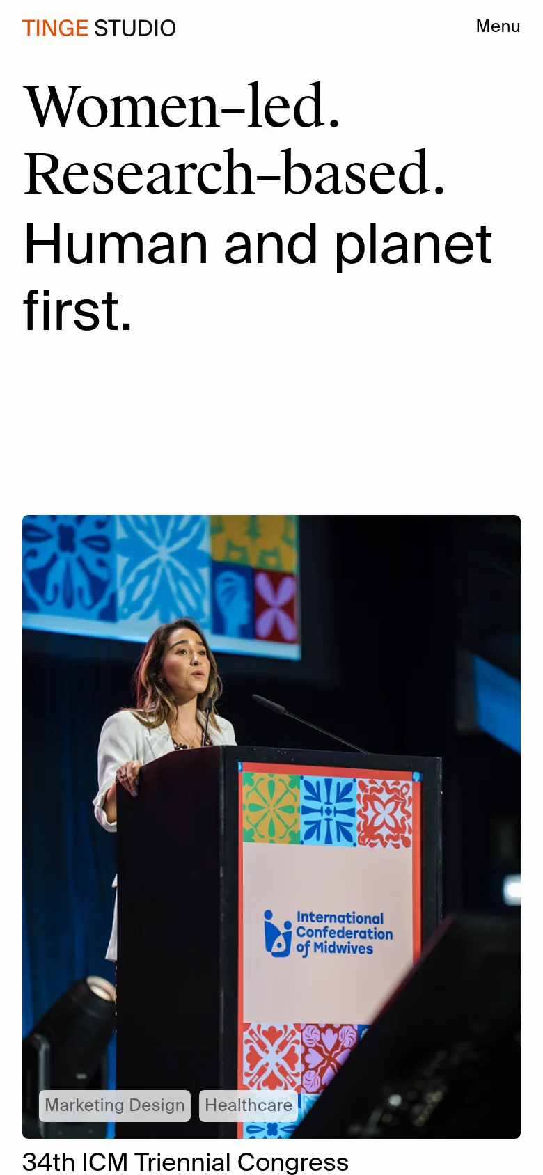 The mobile version presents a single-column vertical layout, starting with the large 'Women-led' headline and a full-width hero image of a speaker at a podium. The navigation is condensed into a 'Menu' button at the top right, and the project grid is stacked vertically for easier scrolling on smaller screens.