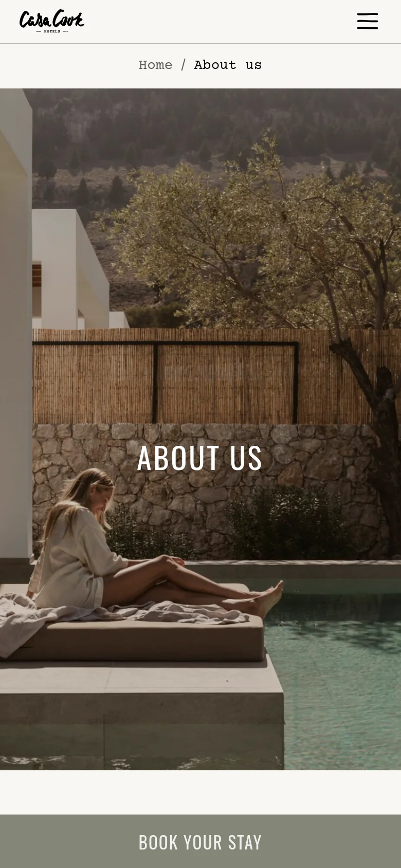 The mobile version presents a vertically stacked layout starting with a large hero image of a person by a pool with the 'ABOUT US' heading. The navigation is simplified with a hamburger menu icon, and the booking widget is condensed into a single 'BOOK YOUR STAY' button at the bottom of the screen. The overall aesthetic remains minimalist with a focus on large, high-quality imagery and earthy colors.