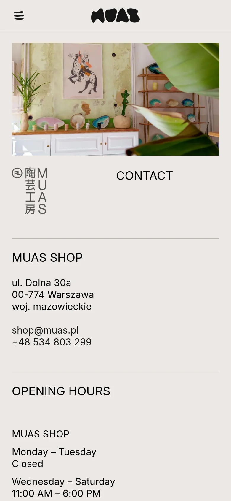 The mobile version presents a vertically stacked layout, starting with a large hero image of the shop interior. The contact information, shop address, and opening hours follow in a single-column format for easier scrolling on smaller screens.