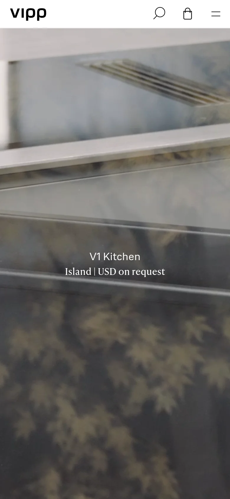 The mobile version presents a simplified, vertical layout with a large, full-width hero image of a kitchen detail. The header is condensed to a logo, a search icon, a shopping bag icon, and a hamburger menu icon. Text overlays like 'V1 Kitchen' are centered over the imagery to maintain a clean, visual-first experience.