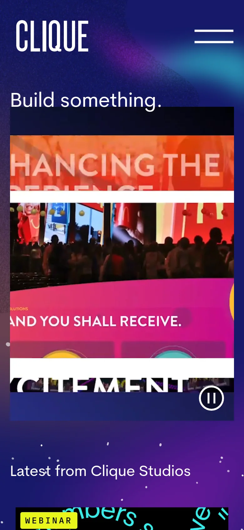 The mobile version simplifies the layout with a centered 'CLIQUE' logo and a hamburger menu icon on the right. The 'Build something.' headline and video player are stacked vertically, and the background maintains the dark, colorful cosmic aesthetic seen on desktop.