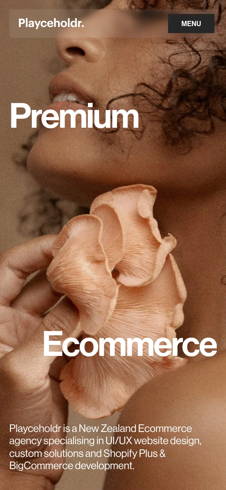 The mobile version simplifies the layout, replacing the top navigation bar with a single 'MENU' button. The hero section maintains the large 'Premium Ecommerce' headline and portrait imagery, but the text is stacked vertically to fit the narrower screen width.